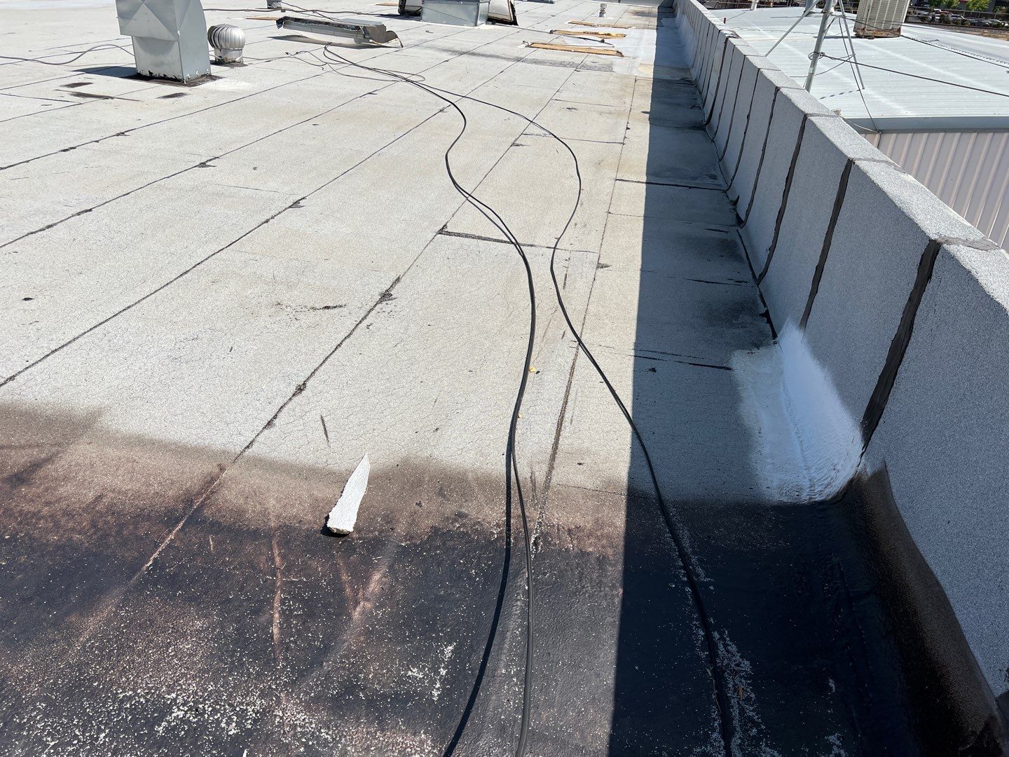 Spray foam and coatings using Conklin Benchmark/PUMA XL coatings and spray foam by Straight Edge Roofing Inc