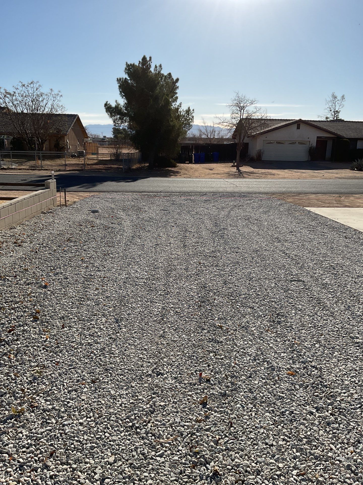 Sleek chain link fence installation with a solar motorized gate by Fence Guys Inc.