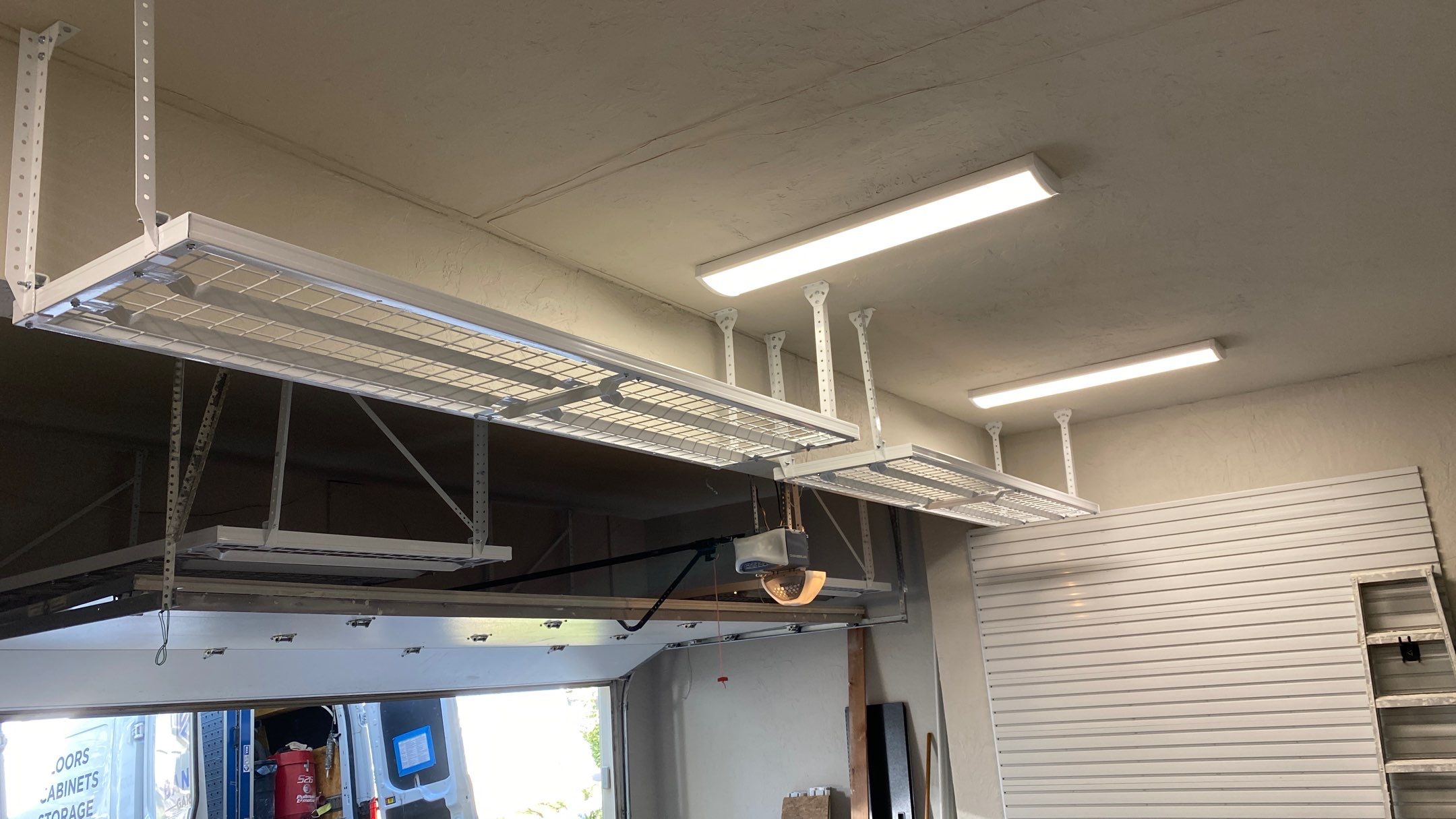 Andrea J. upgrades garage with an overhead ceiling rack!  by Banner Garage