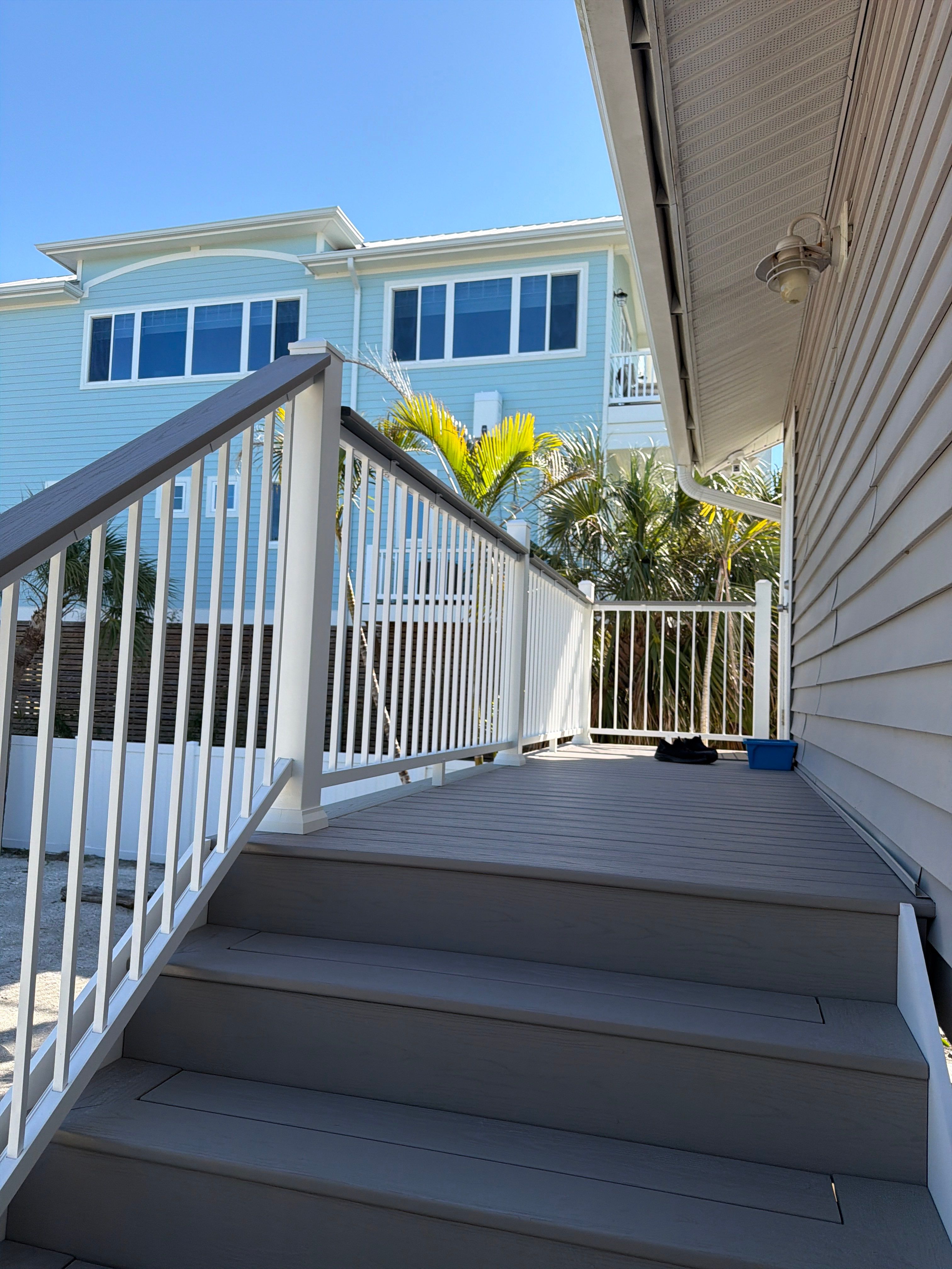 Elevated Coastal Home Renovation with Siding and Custom Decks in Englewood by Smirnov Construction Inc