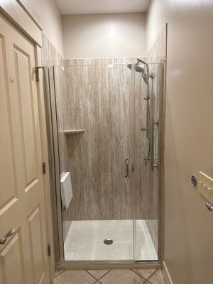 East Jordan Walk-In Shower Remodel with Folding Bench and Chrome Fixtures