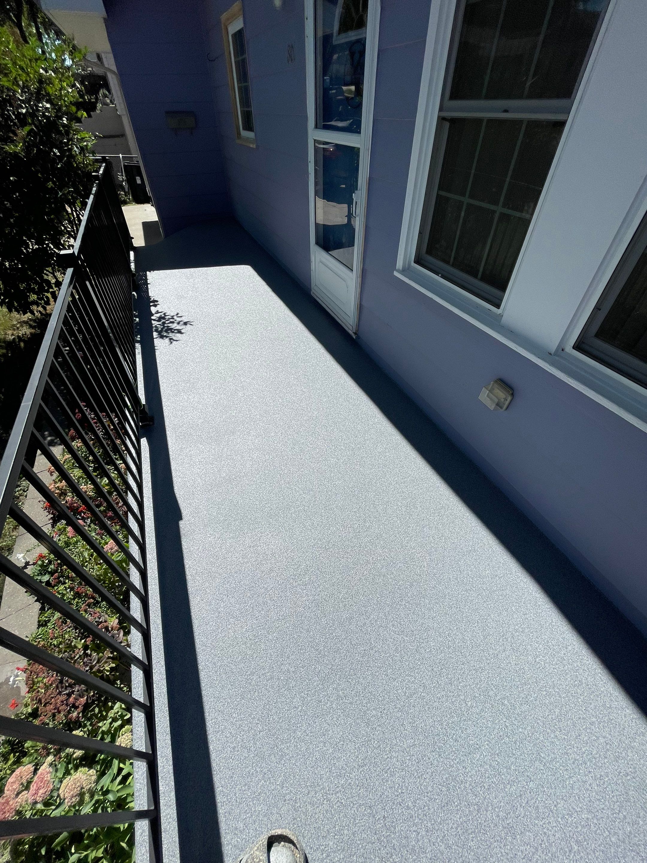Sioux Falls Concrete Porch Coating with Starry Evening Finish by Select Painting, Coatings & Garage Cabinets