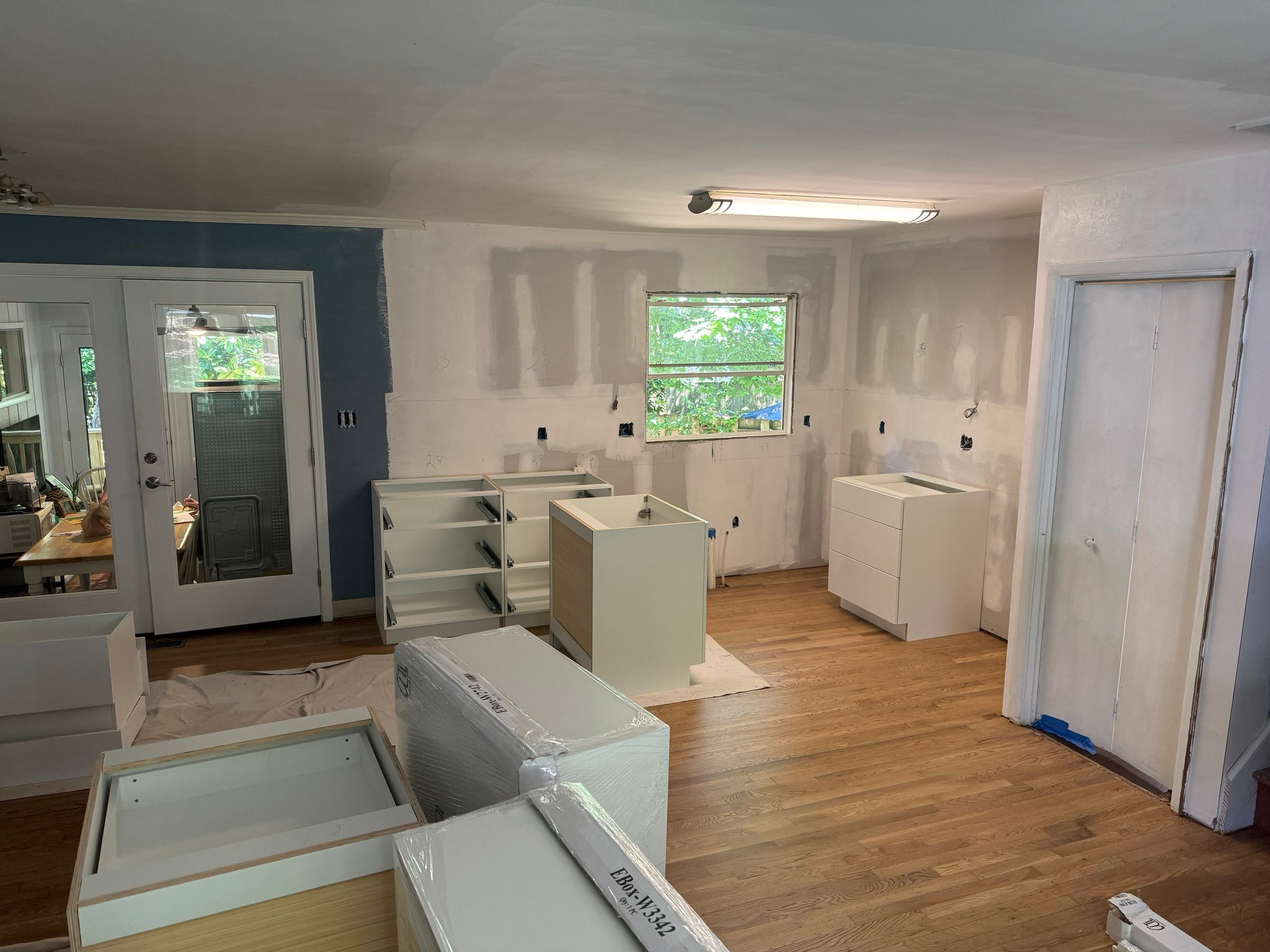Modern Kitchen Remodeling with Large Central Island in Doraville by Swift Home Renovations