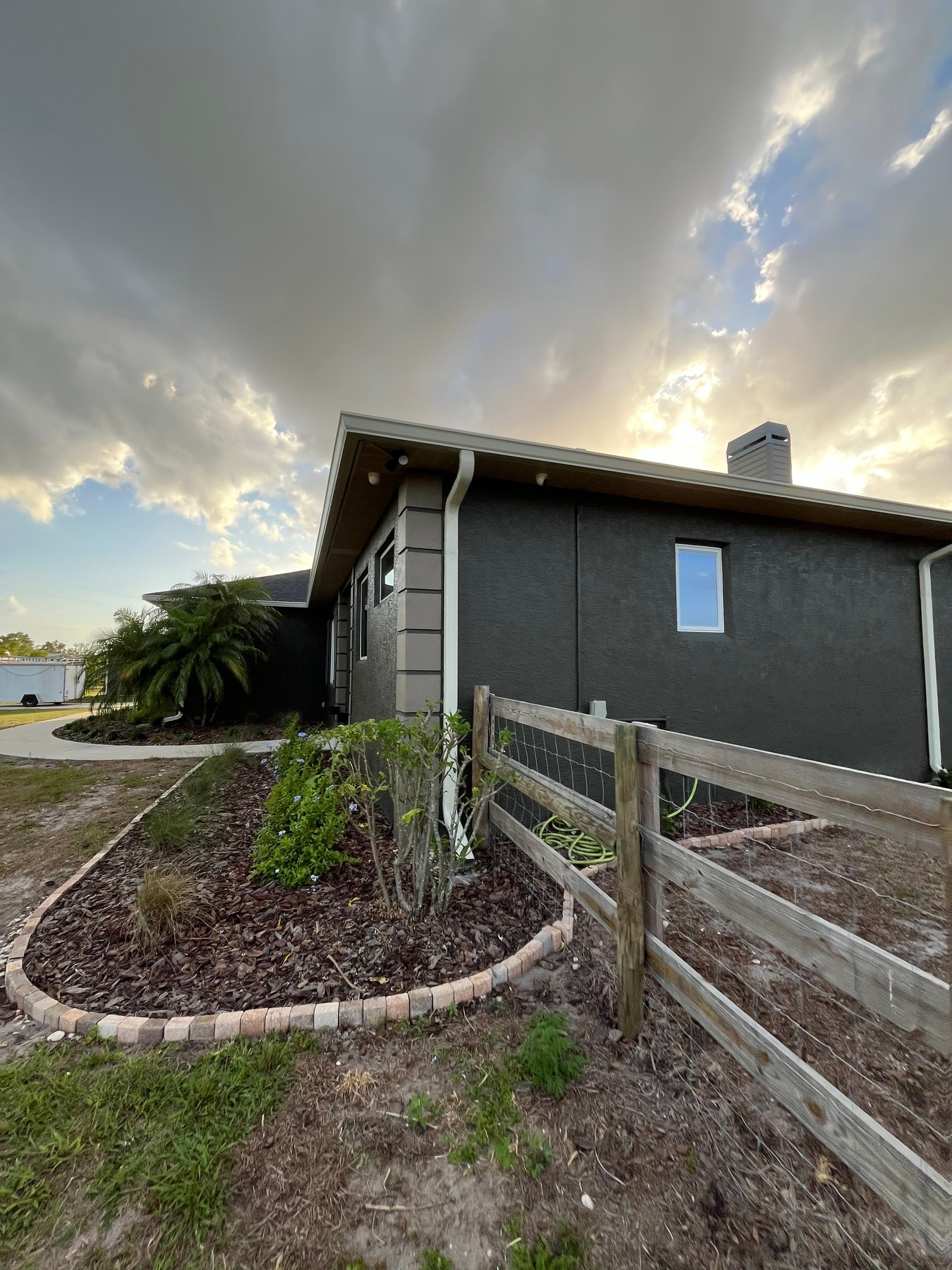  7-inch White seamless gutters and downspouts in Myakka City FL by Gutter Professors