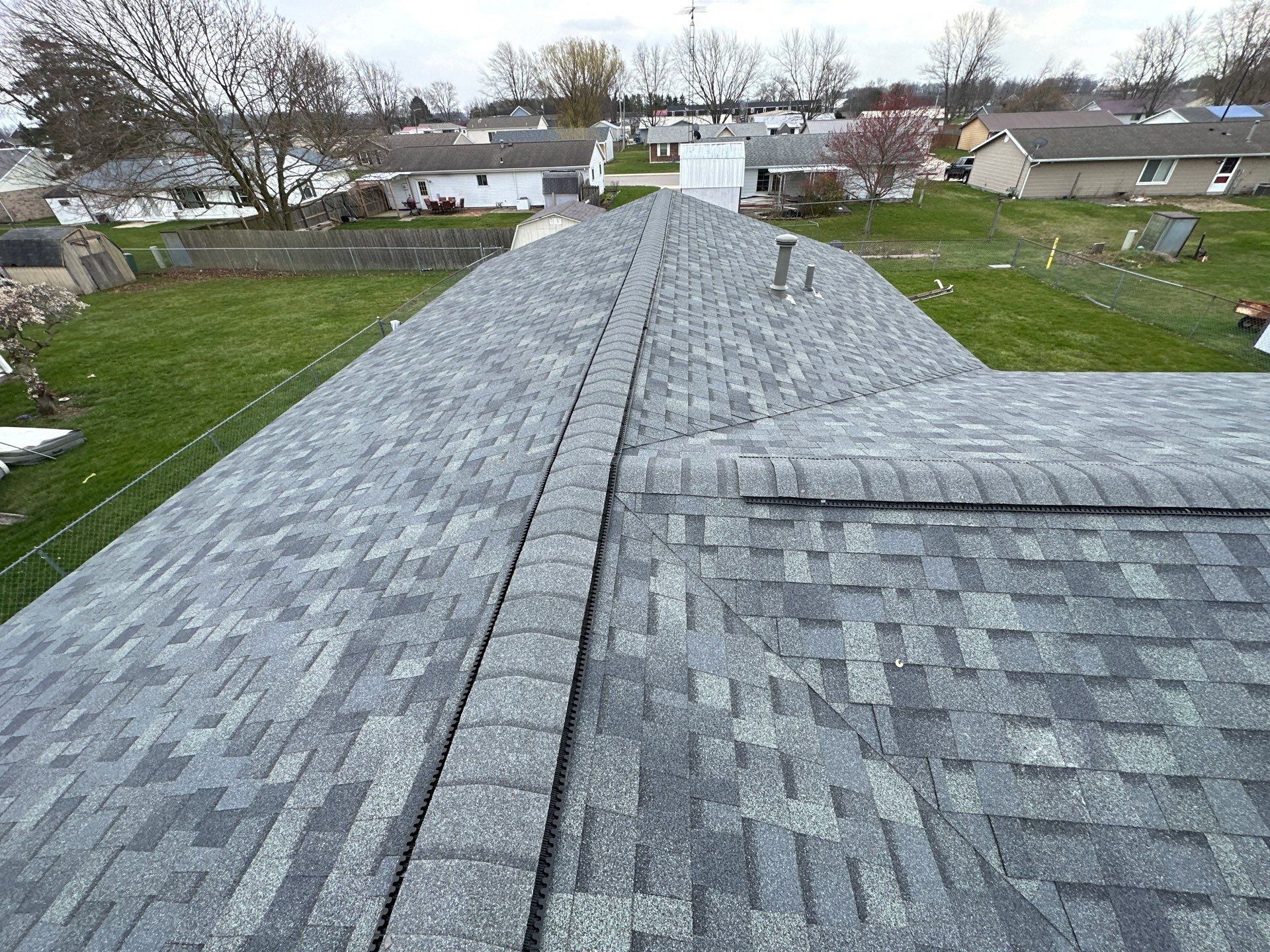 Storm Damage Residential Roof and Siding Installation by WIW Enterprises Inc