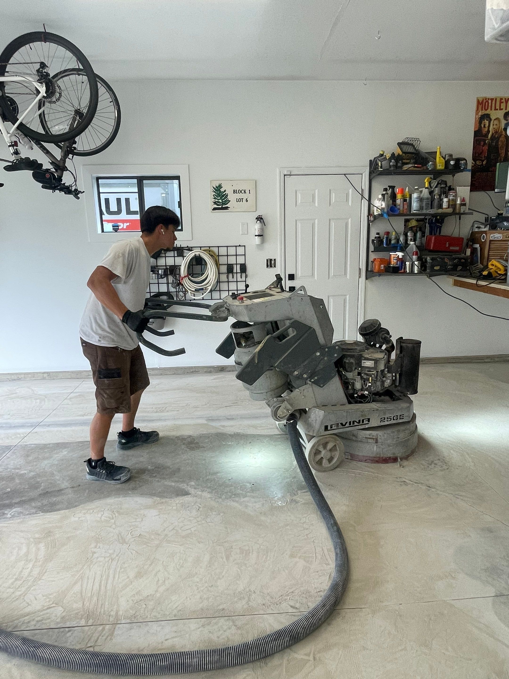 Feather Grey Garage Floor Coating Installation in Sioux Falls by Select Painting, Coatings & Garage Cabinets