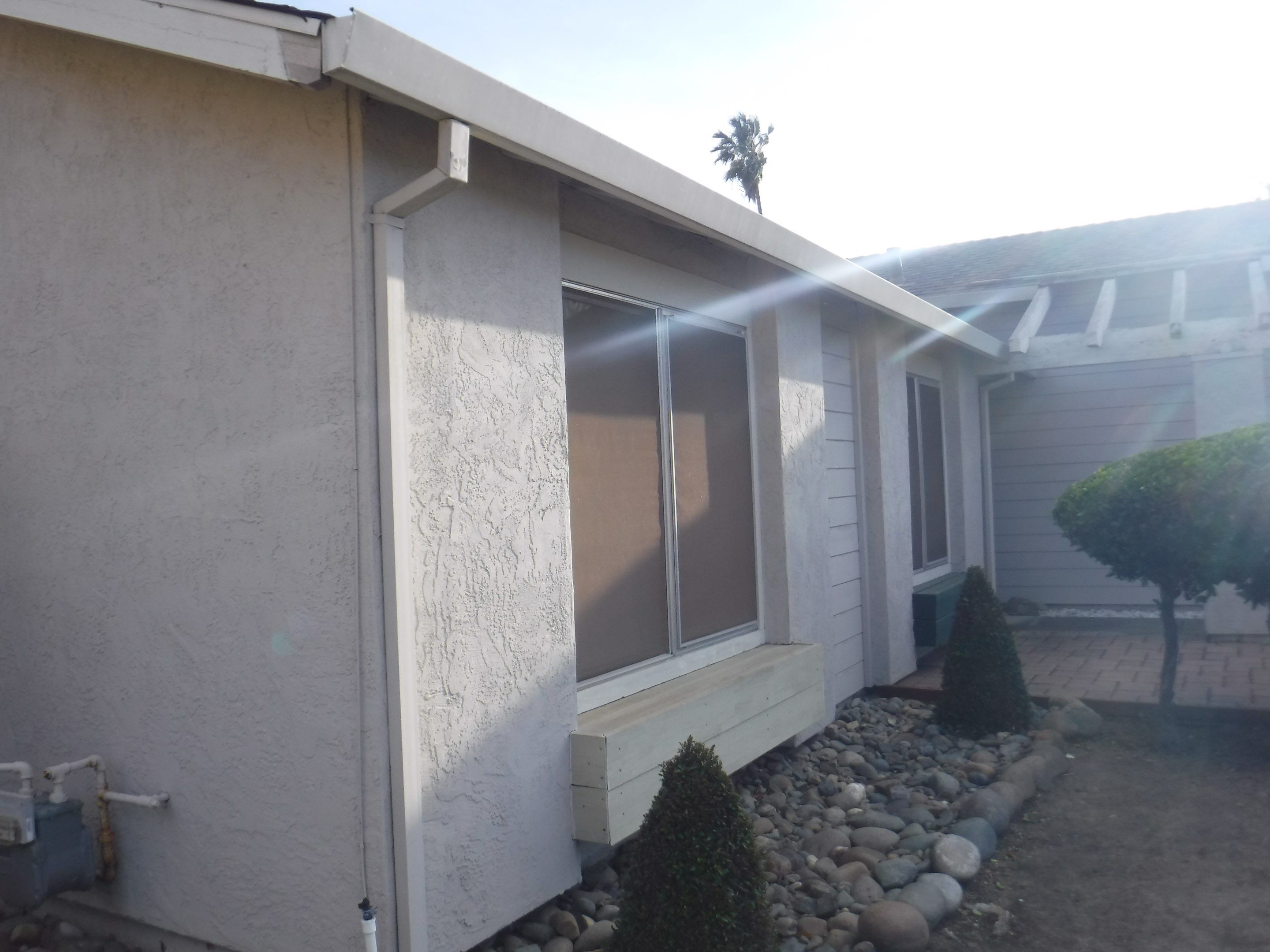 New Roof and Gutters adds value to this home by Byers Enterprises 