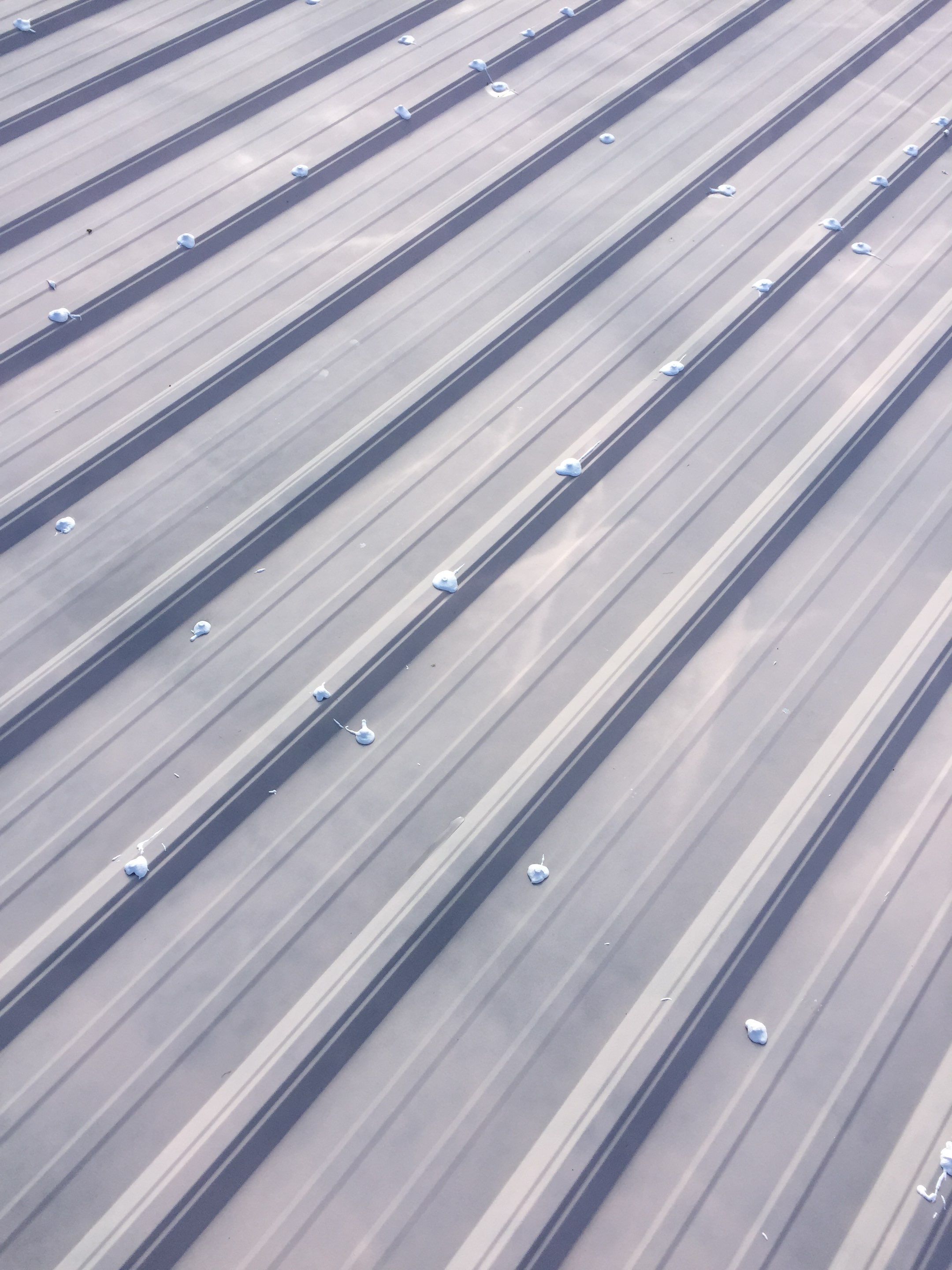 Commercial Roof Coating using Gaco Silicone Roof Coating by Secure Construction Company Inc