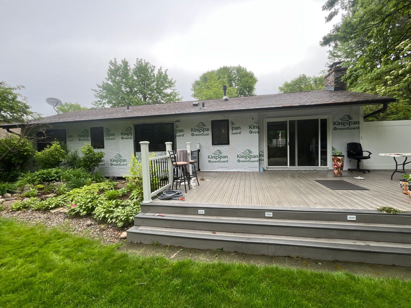 Premium Exterior Remodel – Alside Charter Oak Siding, Hayfield Black Frame Windows, Edco Soffit & Fascia by First Impressions Exteriors