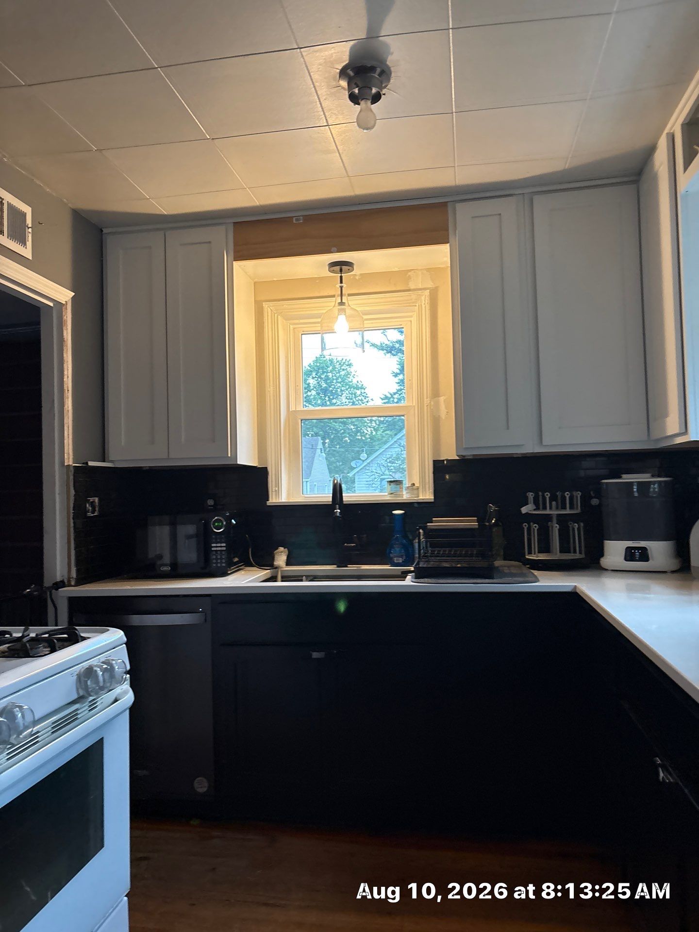 Modern Kitchen Renovation with Black and White Cabinetry in Lincoln by CompanyCam Sales Demo