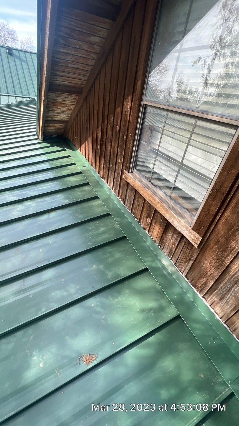 Shingle to Standing Seam Metal Roof by Springtree Restoration