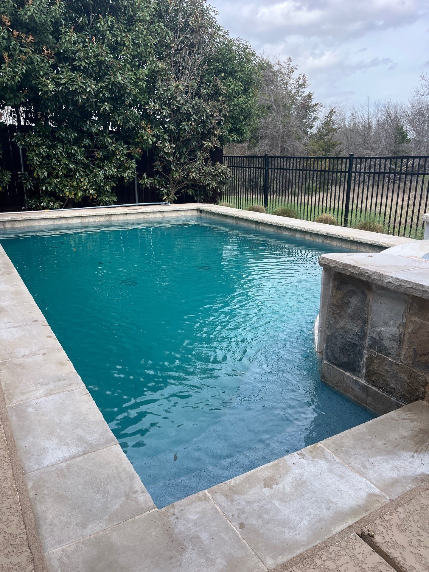 Geometric Pool Remodel with Raised Stone Spa by Pinnacle Pools and Spas - DFW