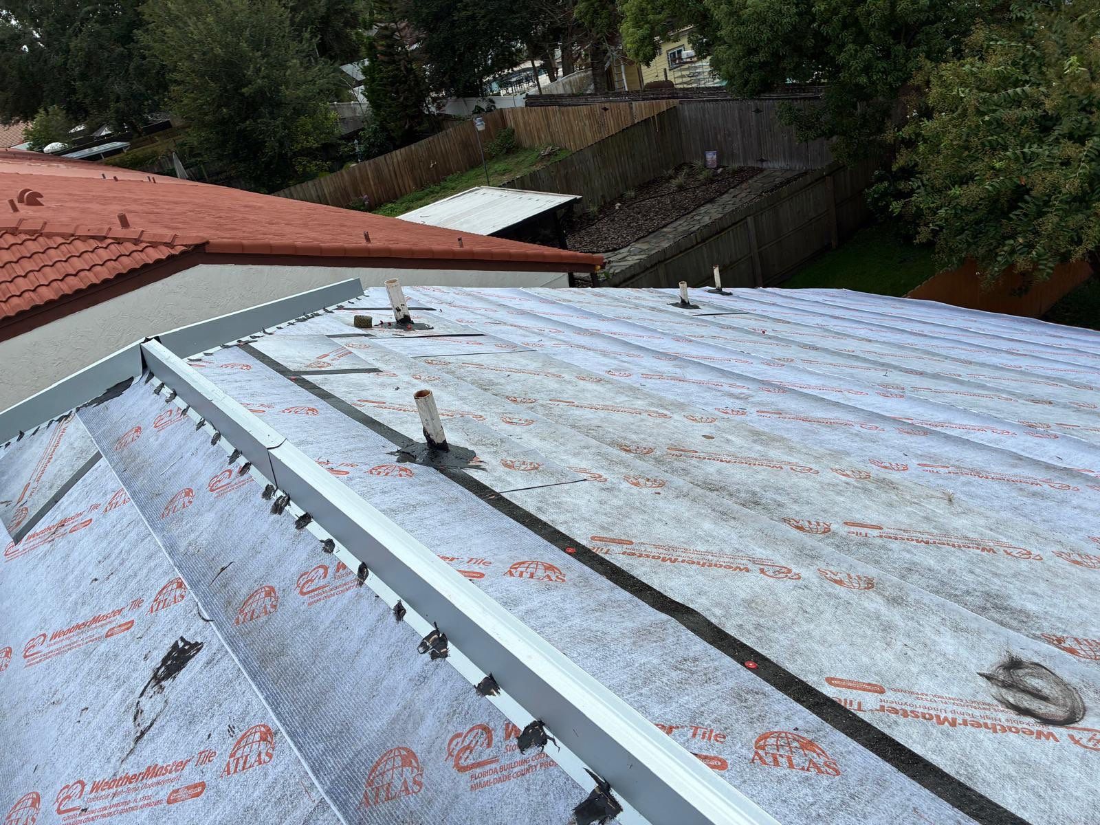 Residential Tile Roof Replacement and Gutter Installation in Winter Park by Pinnacle Roofing Group