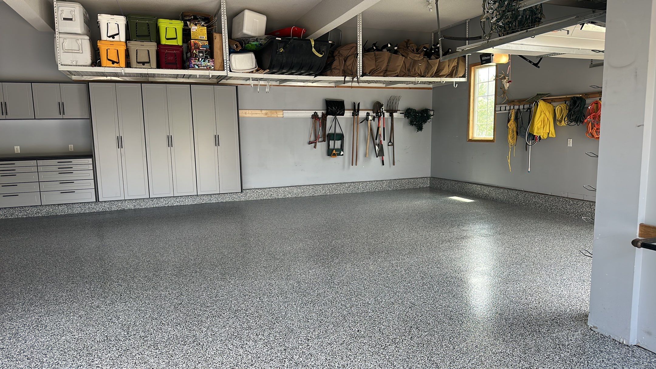 Matt N. took his garage to the next level with our Domino floor and cabinets  by Banner Garage
