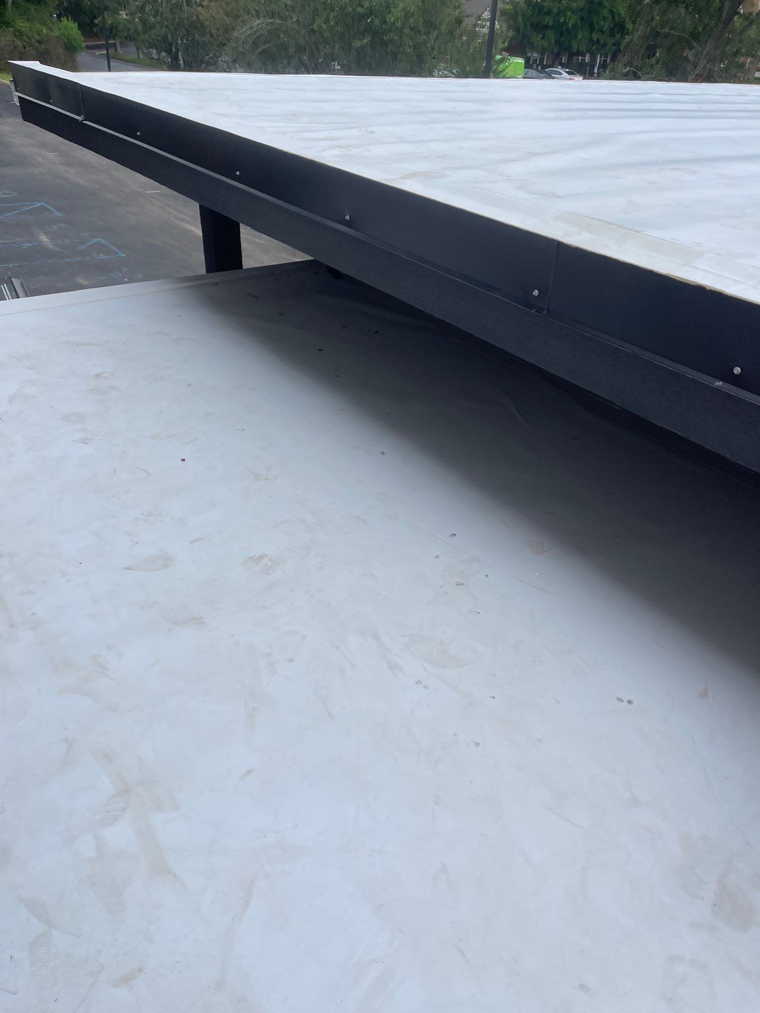 Commercial Roofing Installation using Roof Replacement by American Roofing & Construction LLC