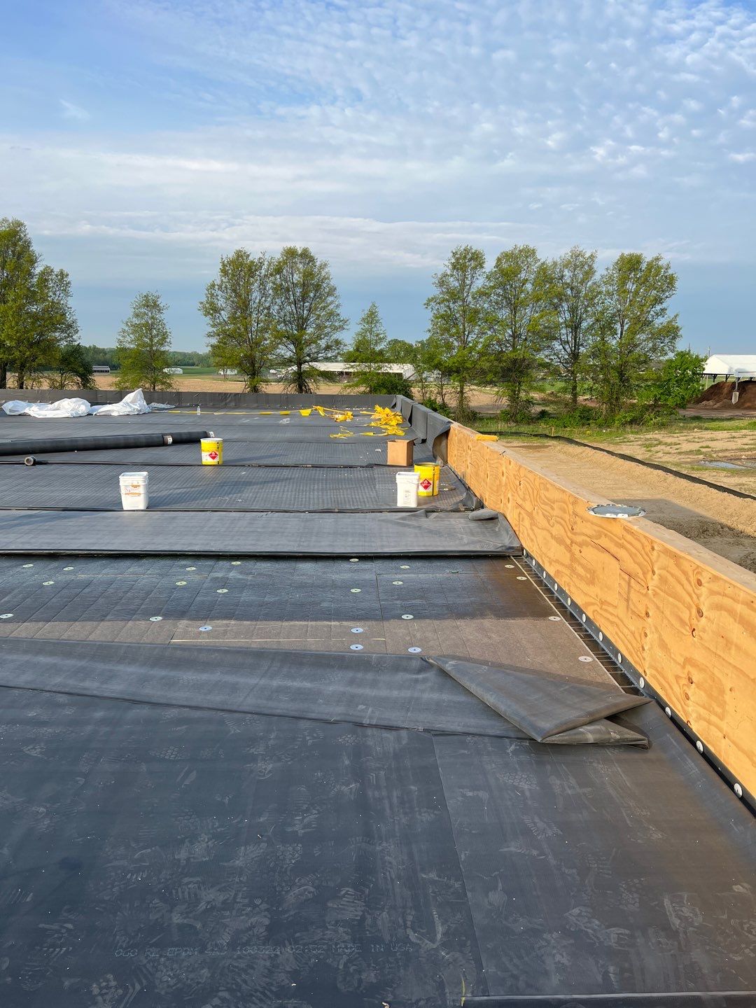 Commercial Roofing Installation using 60 mil rubber roof  by Nitro Roofing and Construction