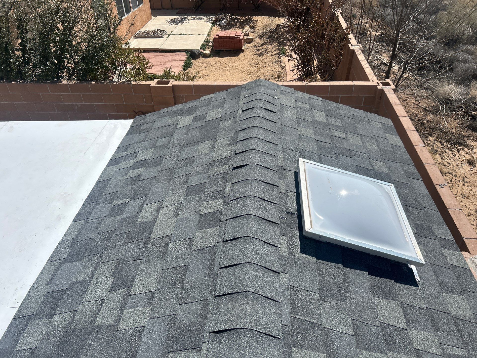 Santa Teresa St NW • Albuquerque, NM 87120 New shed roof, fascia and gutters by Doyle Roof Masters Inc
