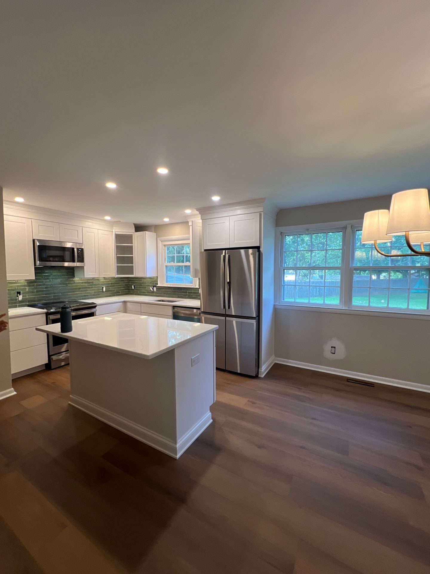 Phoenixville Kitchen Remodel with White Shaker Cabinets and Green Backsplash by Reliable General Contracting