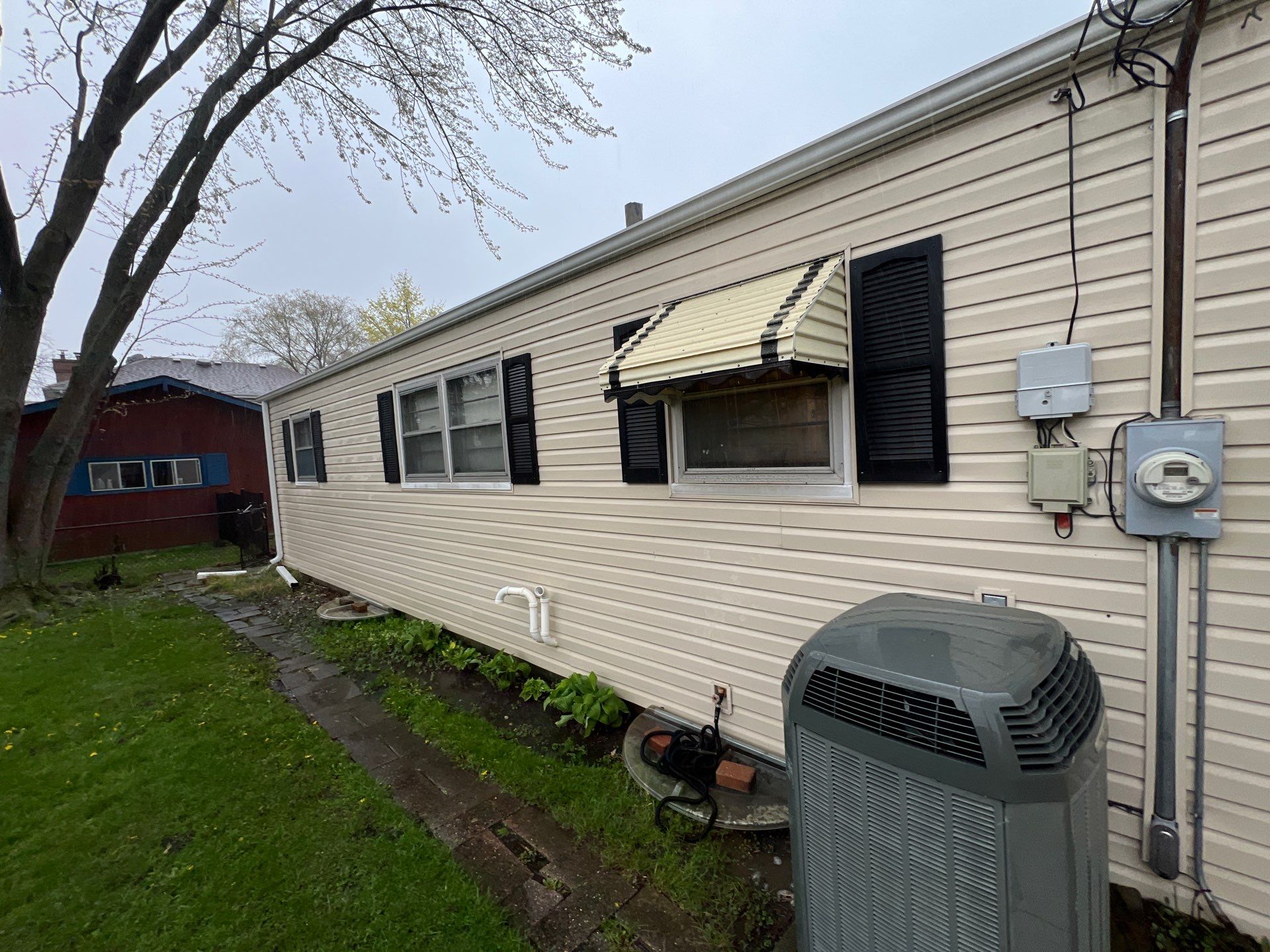 Housewashing  using Algaecide, soft wash soap by Northern Power Washing LLC.