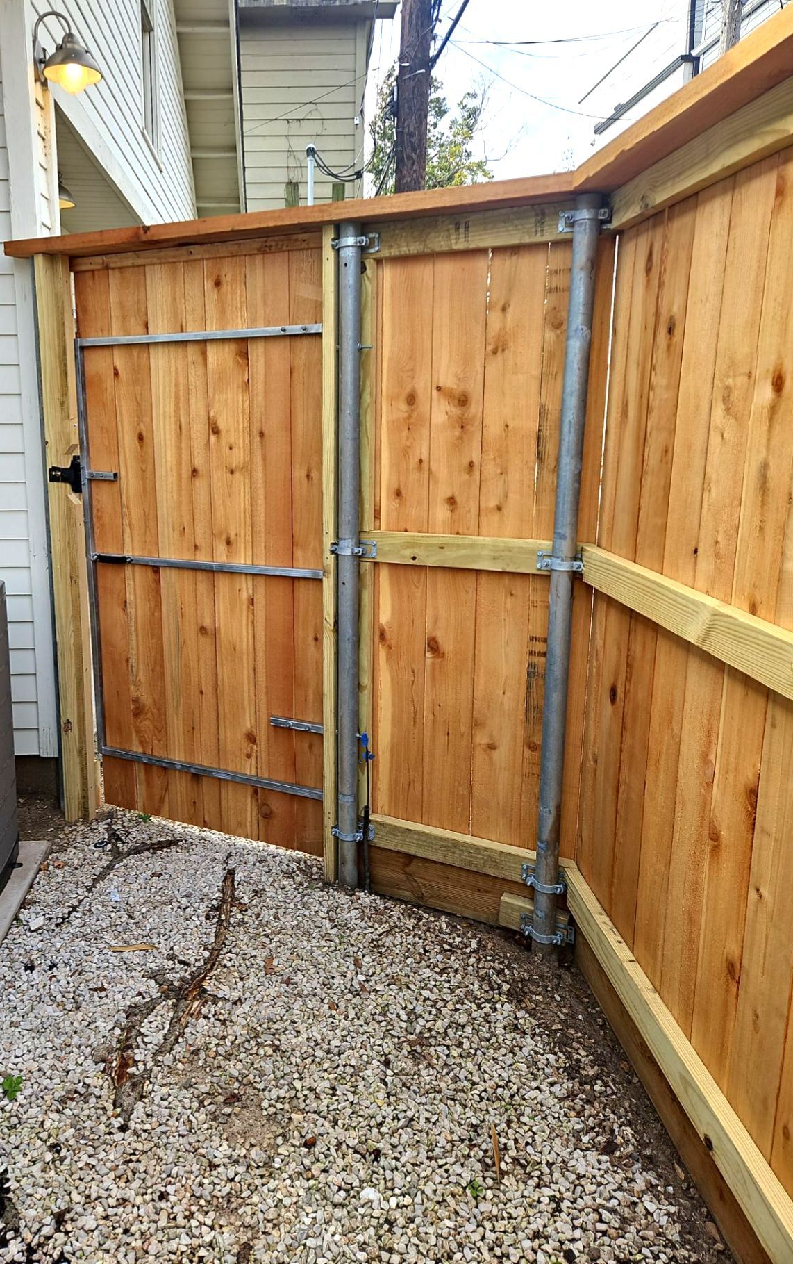 Durable Fence & Gate Installation with Premium Stain by Tim's Fences