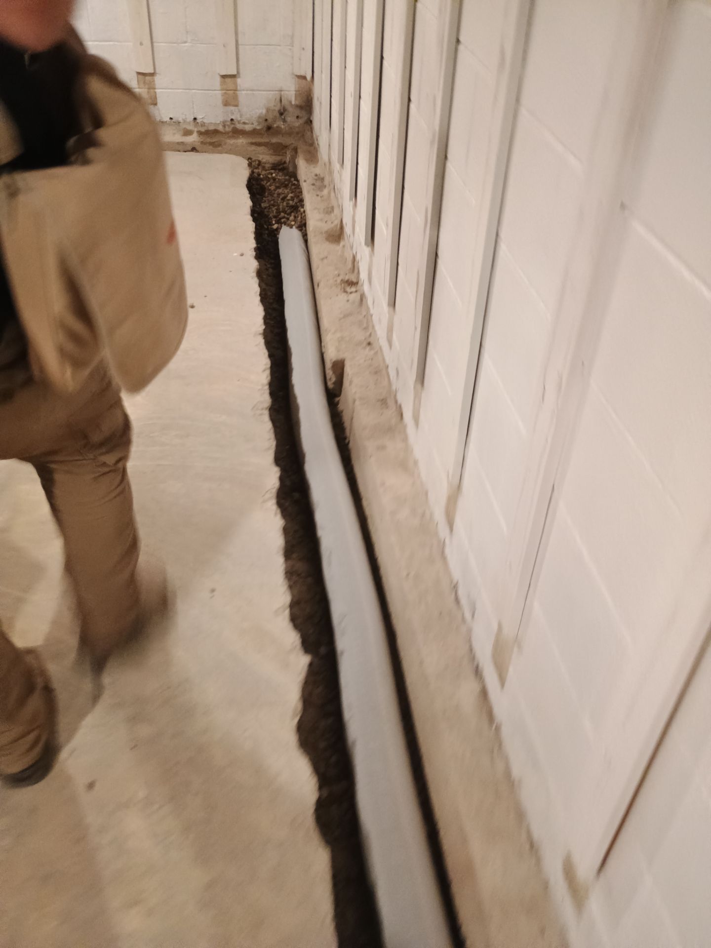 Interior Drain Tile & Buried Discharge in St. Anthony, MN by Waterproofing Northeast