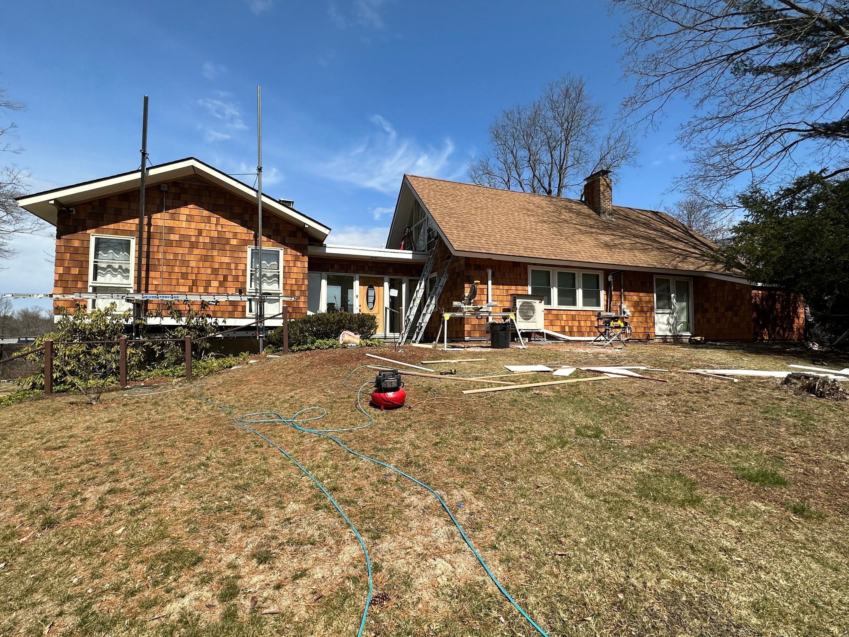 Siding Installation using Perfection Red Western Cedar Shingles  by Loyalty Exterior Solutions 