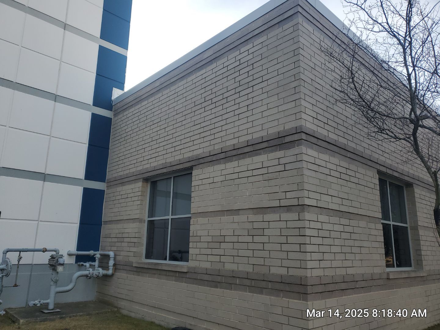 Commercial Facade cleaning using Algaecide, soft wash soap by Northern Power Washing LLC.