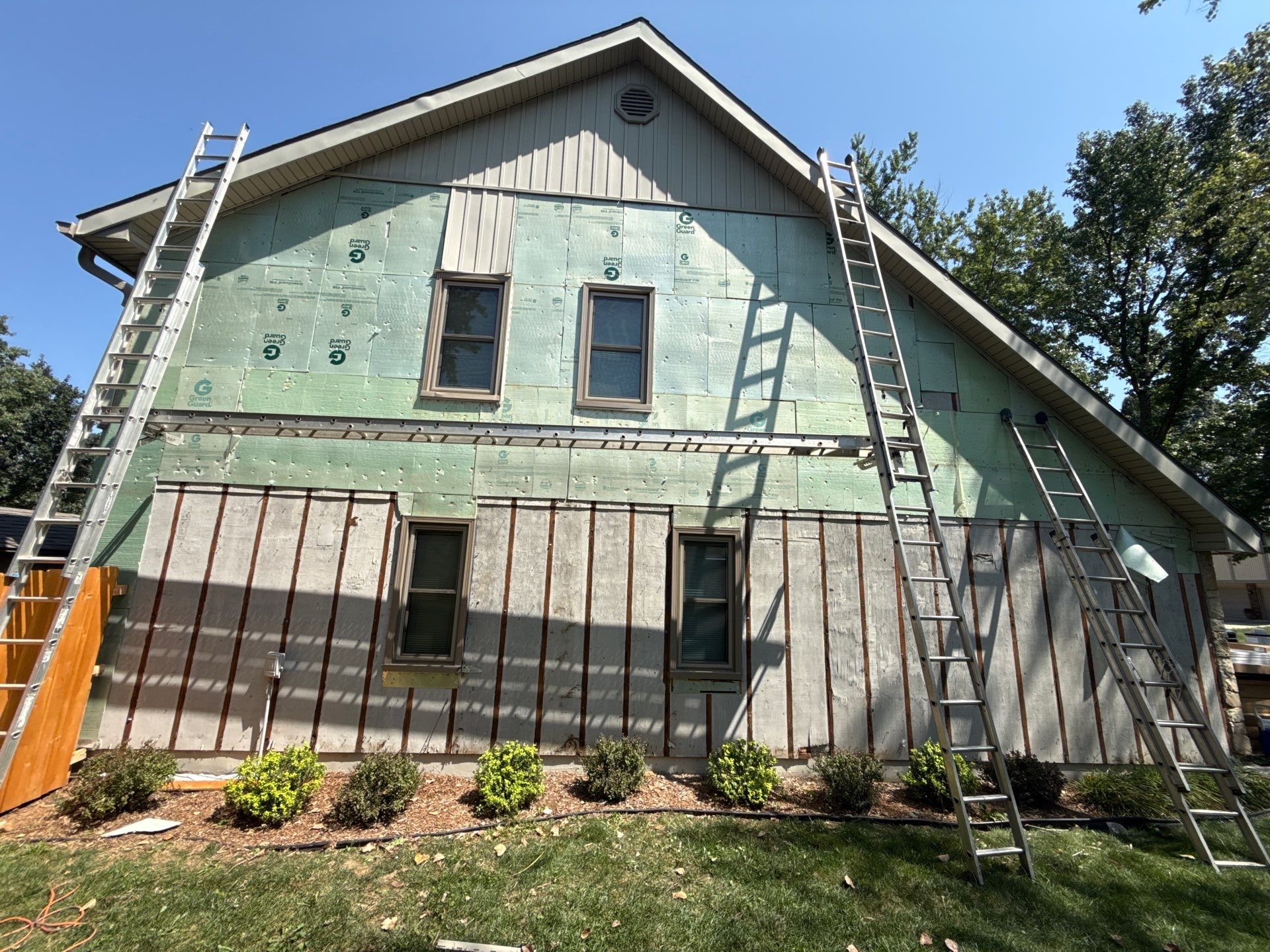 Comprehensive Kansas City Exterior Remodel Featuring Board And Batten Siding by EEC Windows, Siding & Roofing