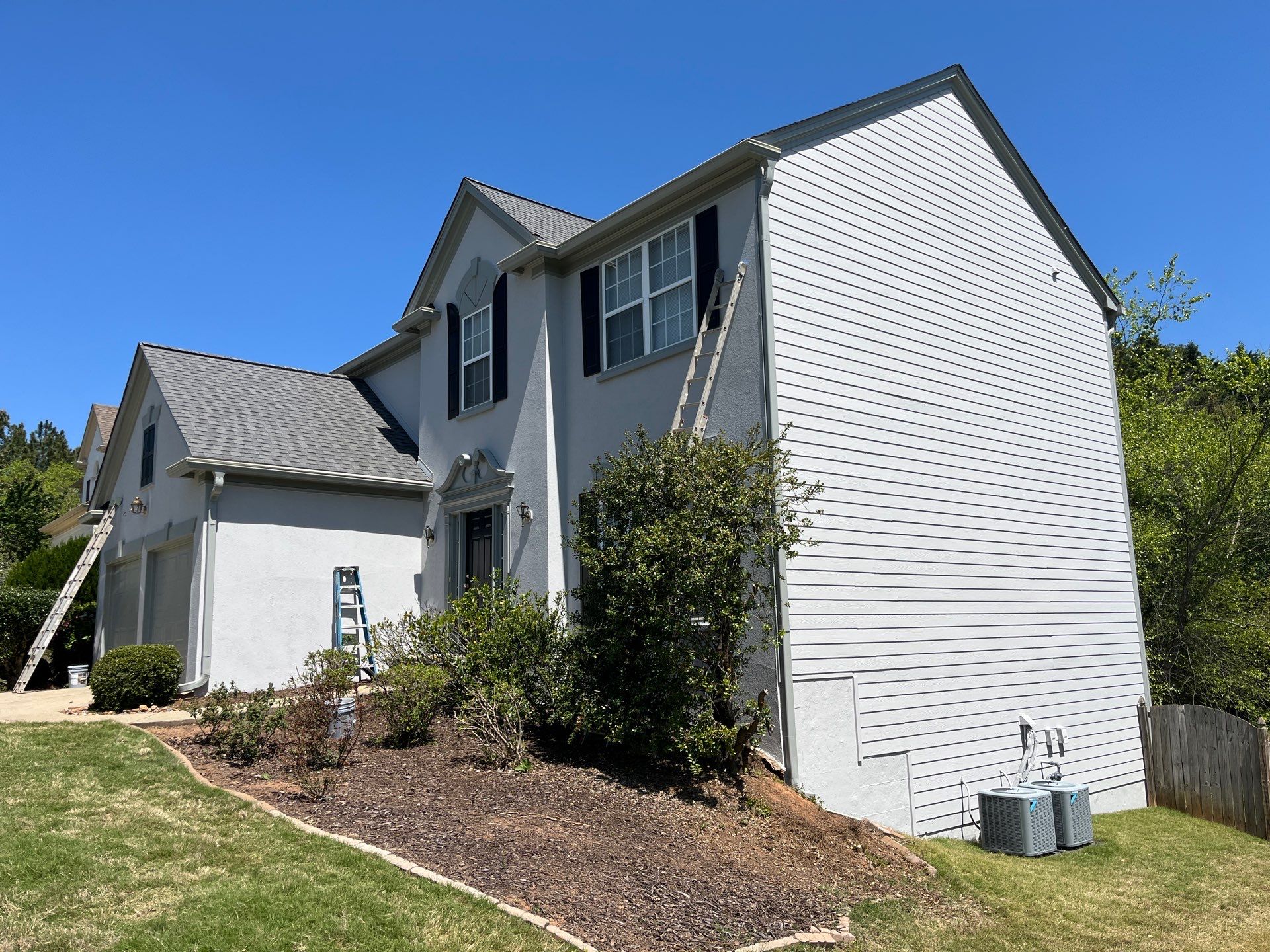 Rotten Wood Replacement Plus Stucco & Siding Painting  by Nelson Exteriors 