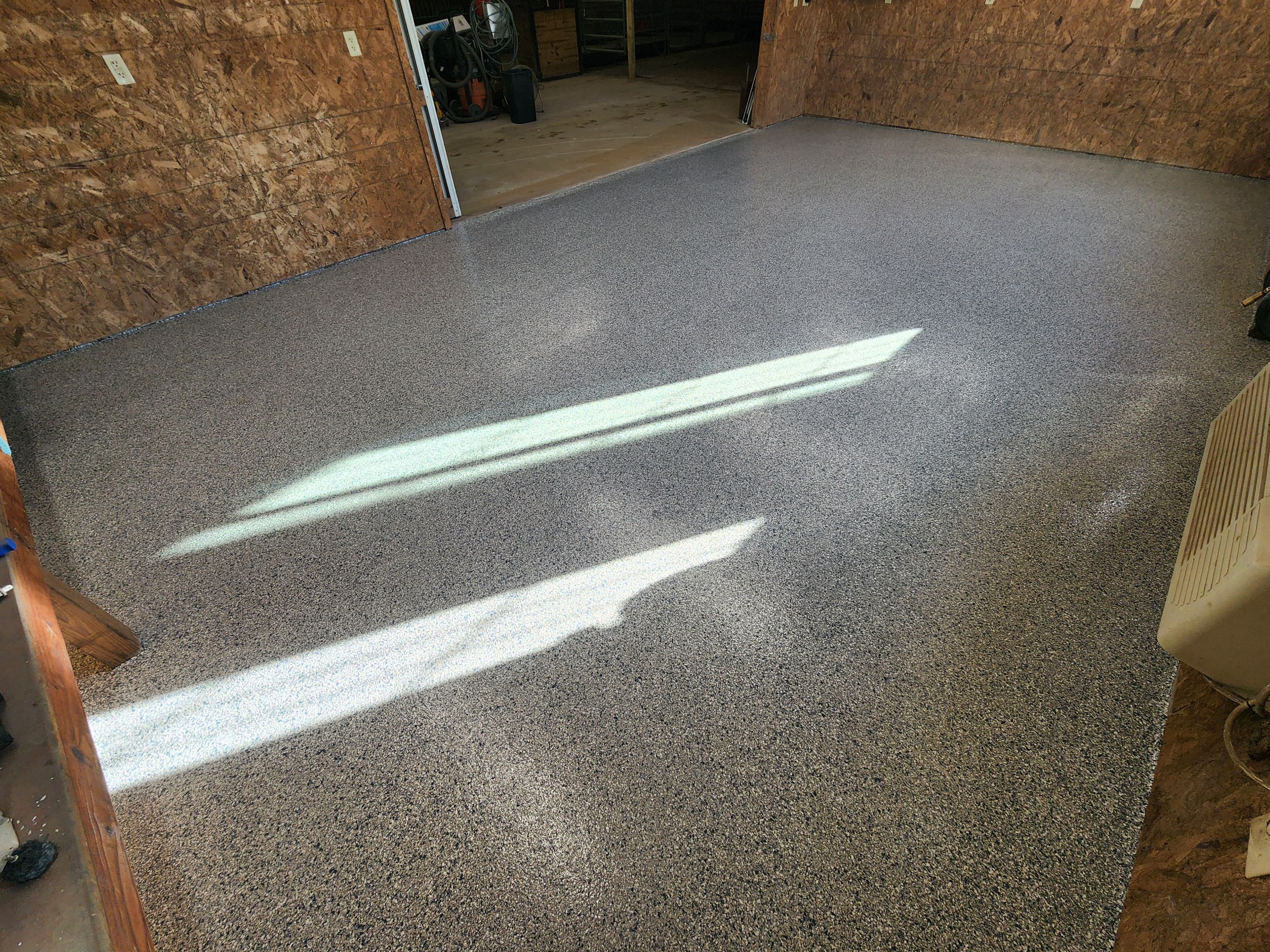 Basement using Tidalwave by Select Painting, Coatings & Garage Cabinets