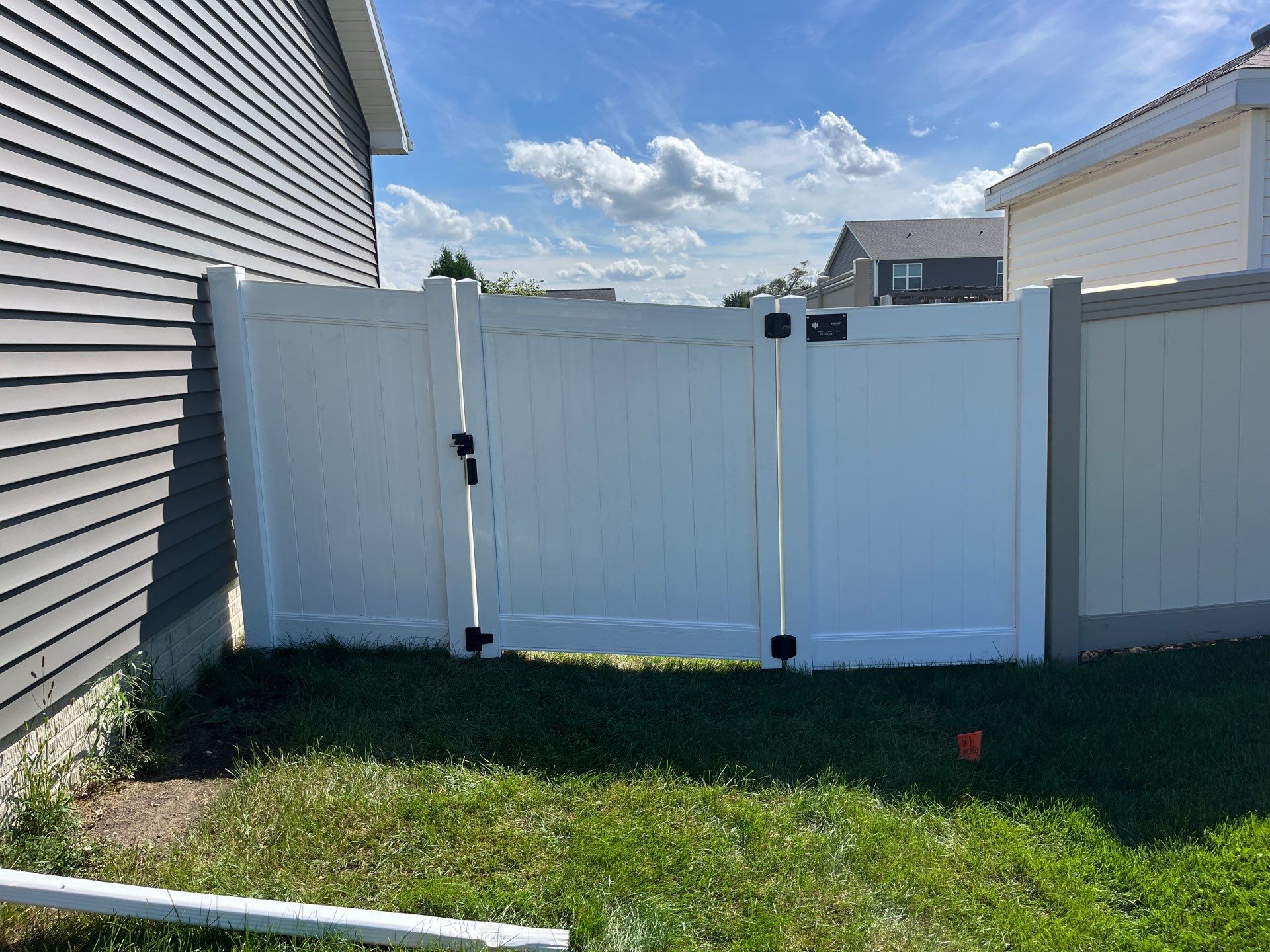 New Vinyl Privacy Fencing and Gates for Waterloo Residential Backyard by Perfect Picket Fence and Stain