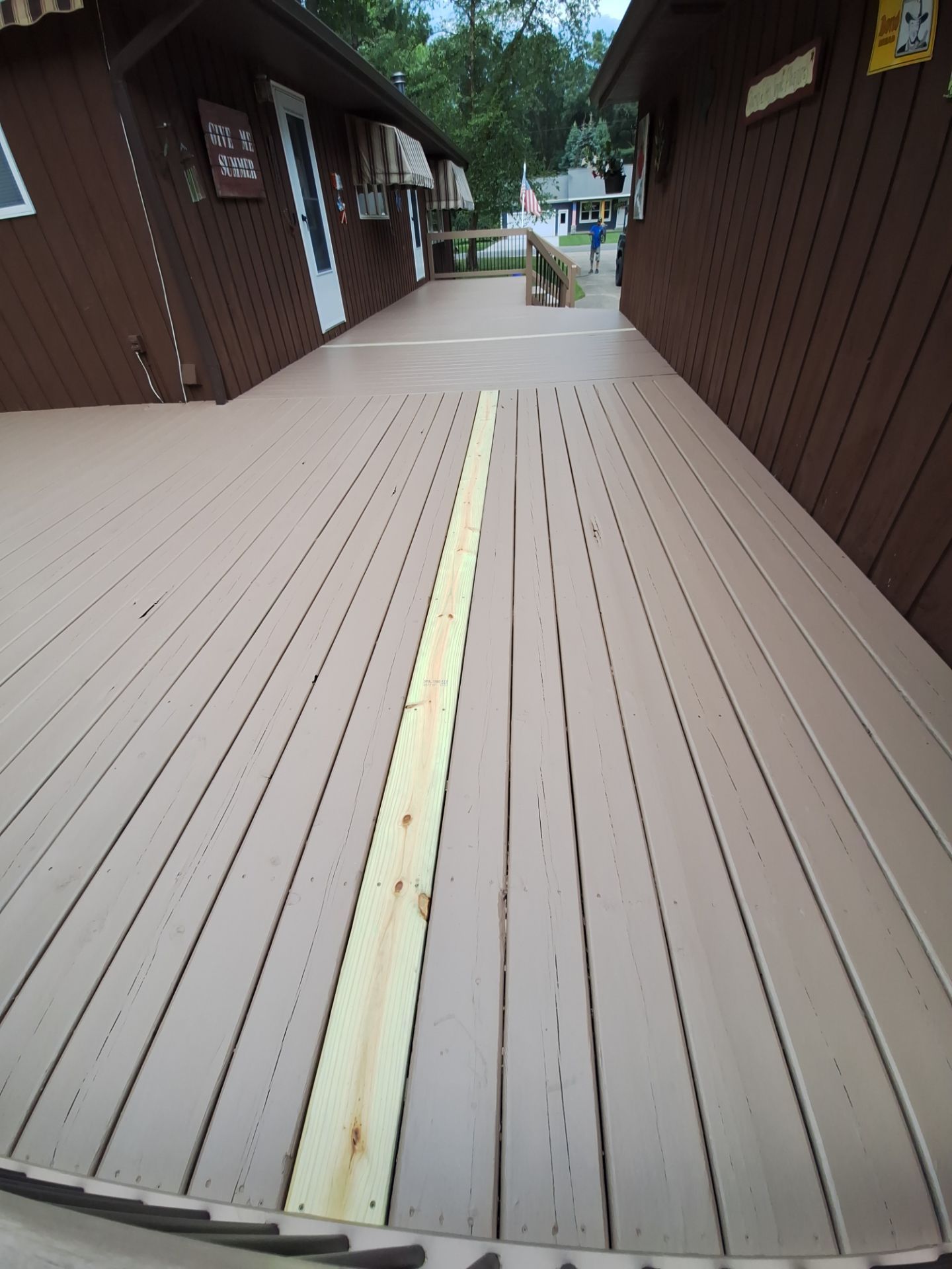 Muskegon Deck Restoration with Pressure Treated Railings and Wood Staining by Gordon Painting