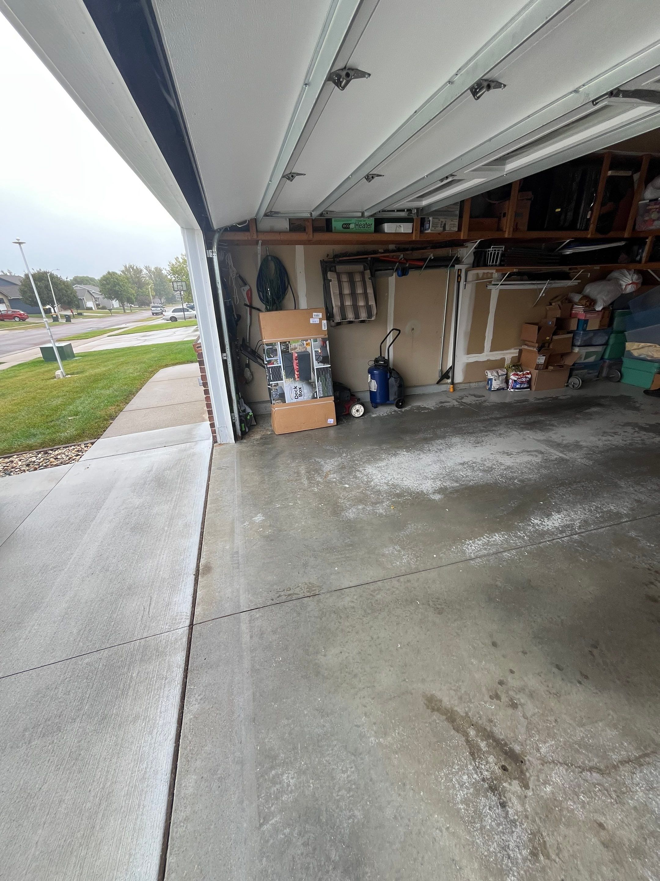 Nightfall Grey Speckled Epoxy Garage Floor Coating in Sioux Falls by Select Painting, Coatings & Garage Cabinets