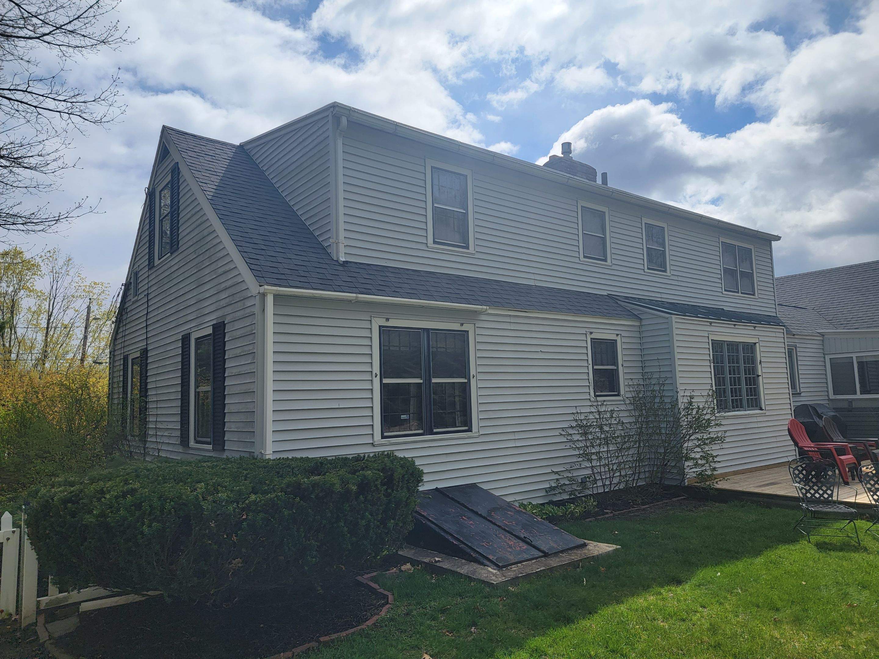 Siding Installation using James Hardie Countrylane red by UBrothers Construction