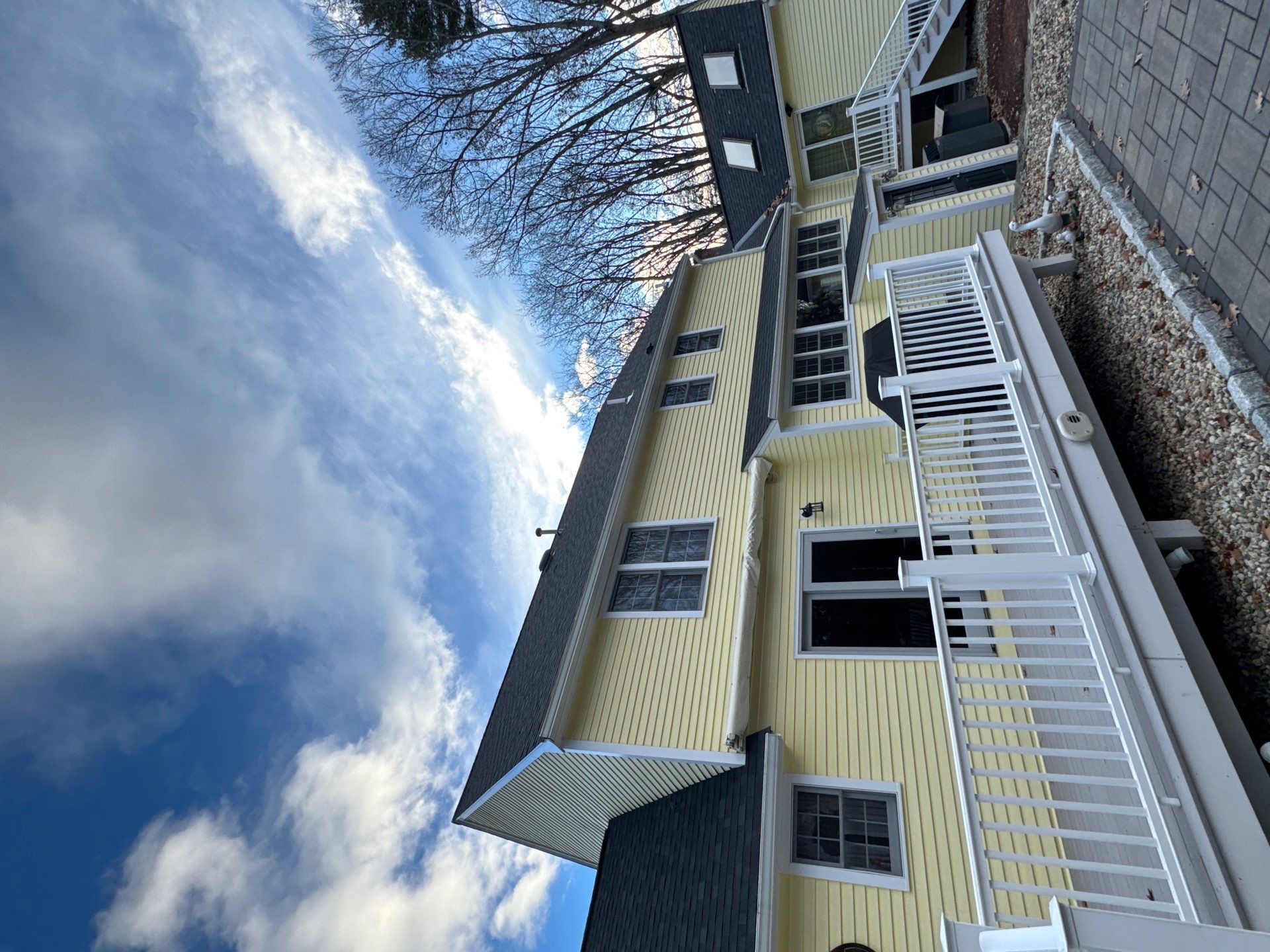 Chelmsford Premium Roof: Onyx Black Shingles with Standing Seam Metal Porch by Mighty Dog Roofing of Greater Middlesex County