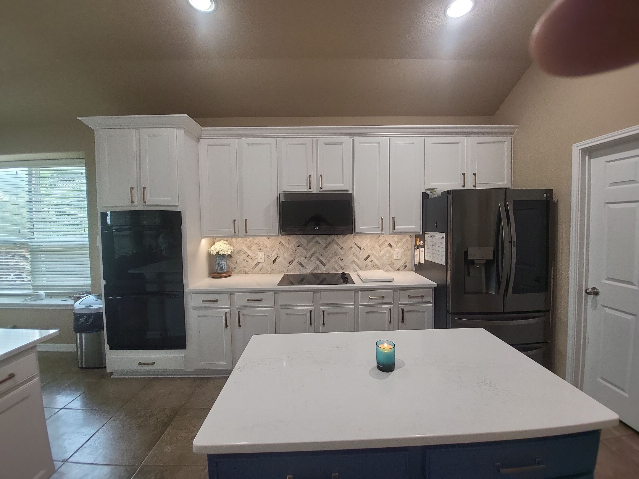 Cibolo Kitchen Refresh with Painted Cabinets, Quartz Countertops & Herringbone Backsplash by Legacy Bath and Kitchen 