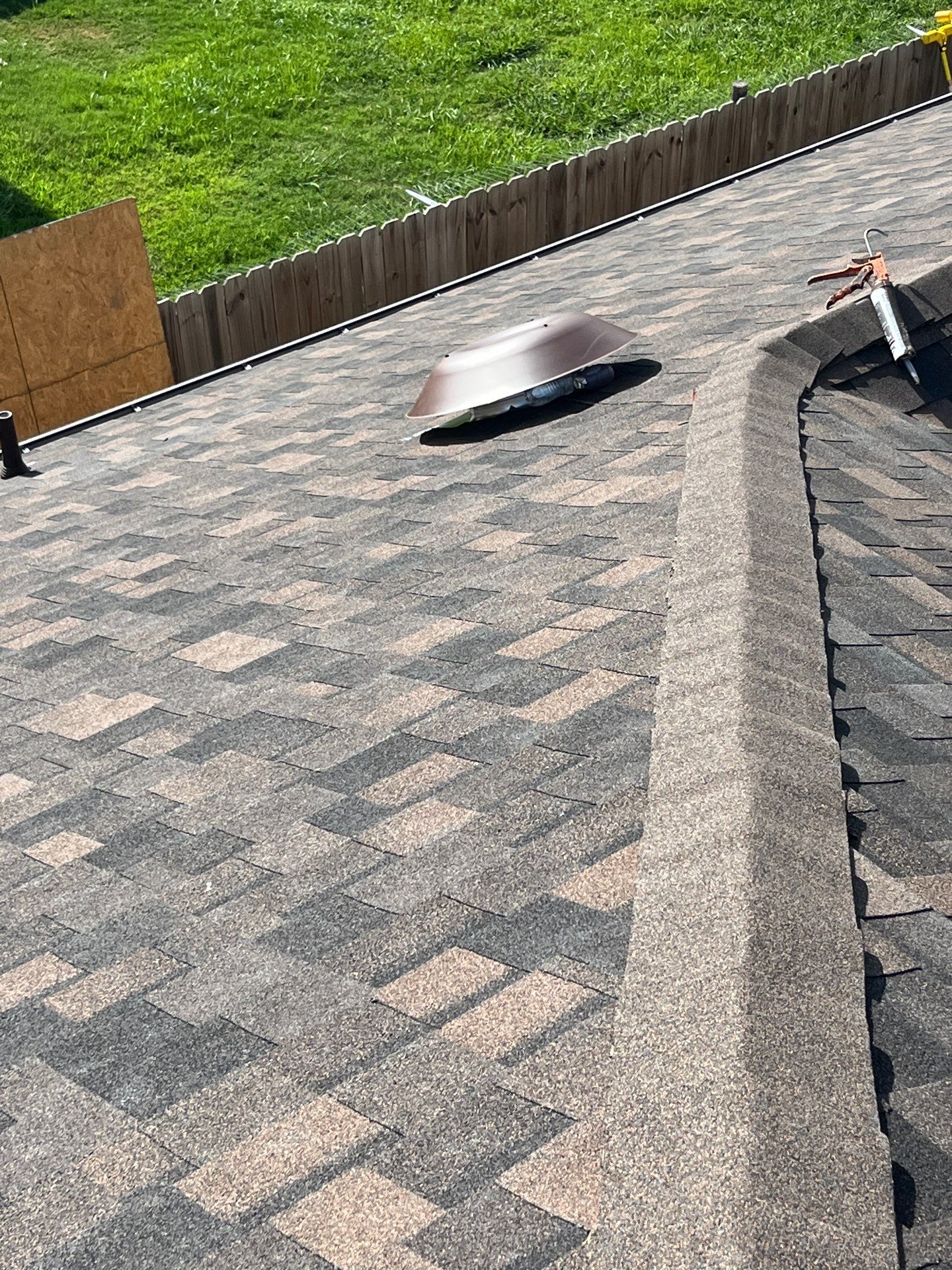 IKO Shadow Brown-Medium brown brick house by Tejas Roofworks + Restoration
