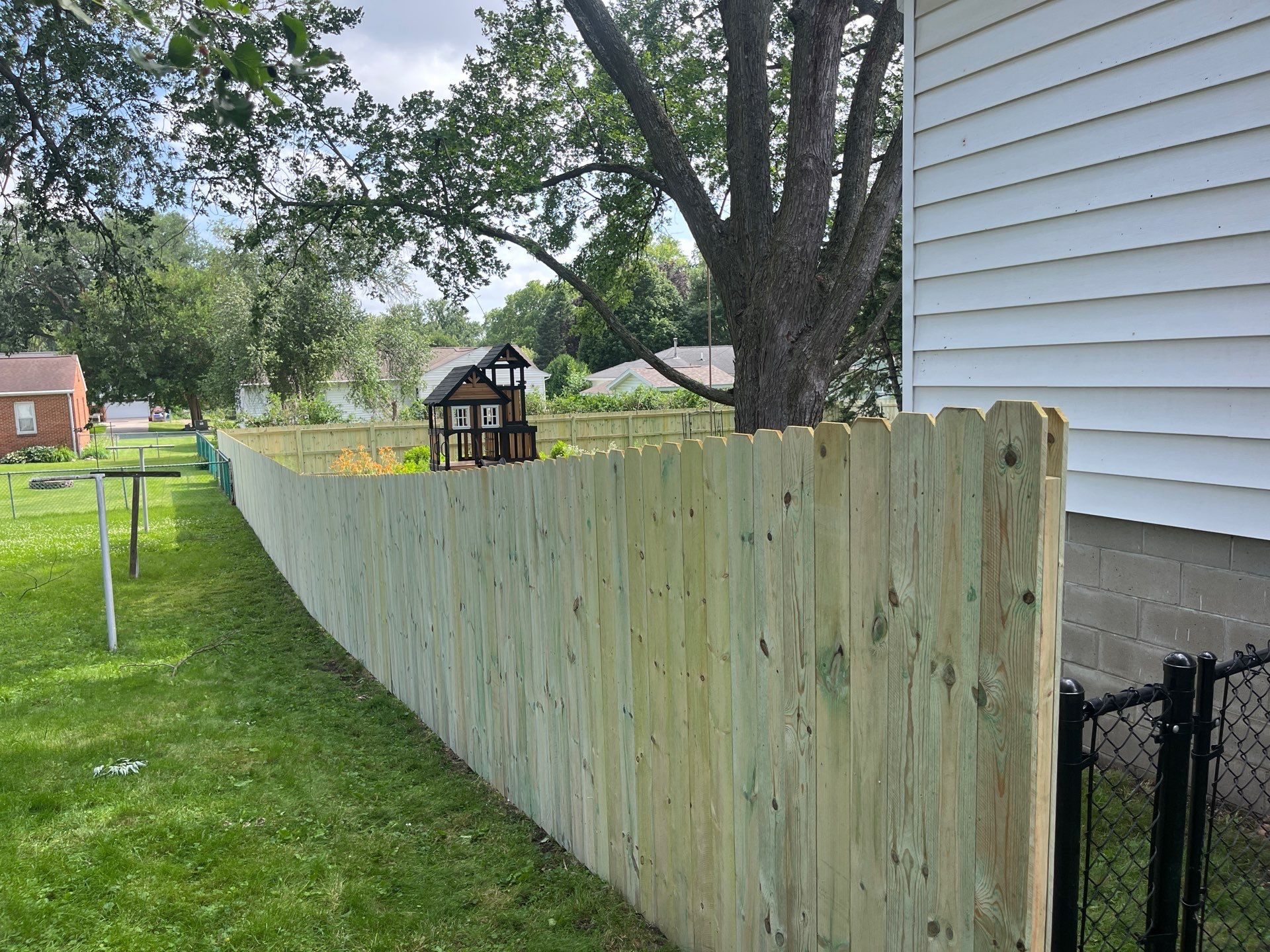 Custom Treated Pine Privacy Fence and Chain Link Installation in Cedar Falls by Perfect Picket Fence and Stain