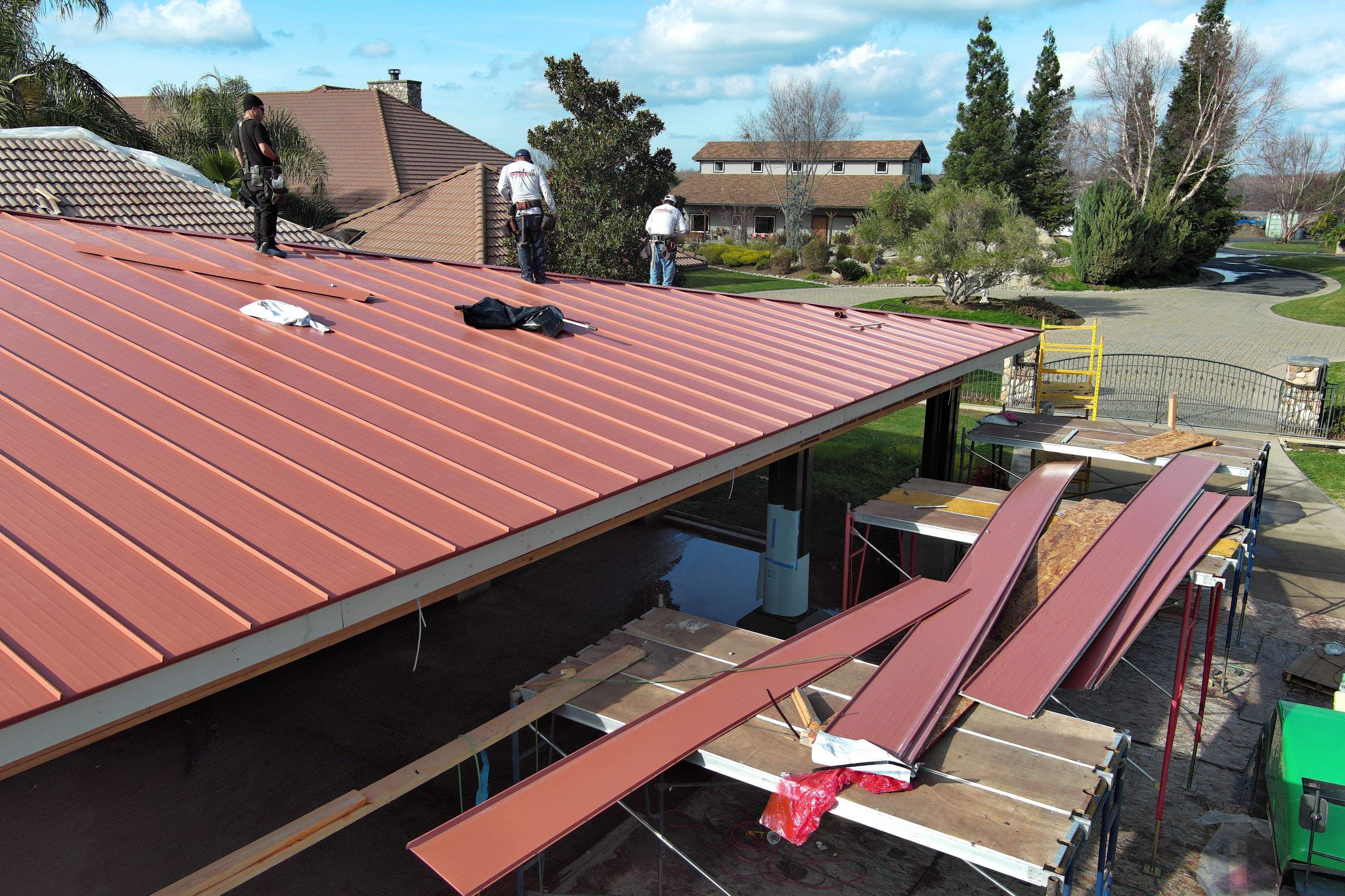 Tile, Metal, and TPO roofing project (new construction) by Straight Edge Roofing Inc