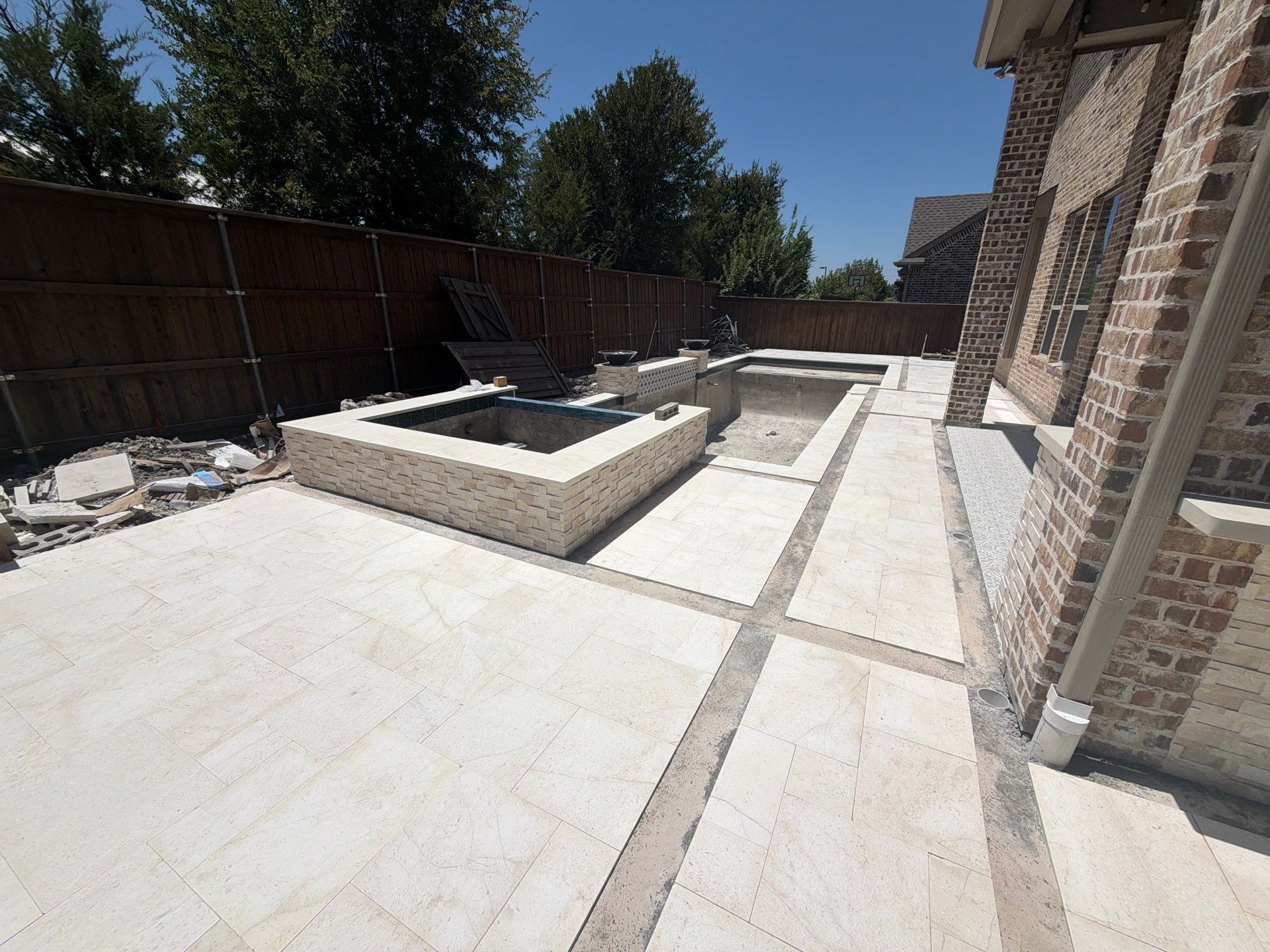 Modern Geometric Pool with Tile Waterfall Wall and Fire Bowls by Pinnacle Pools and Spas - DFW