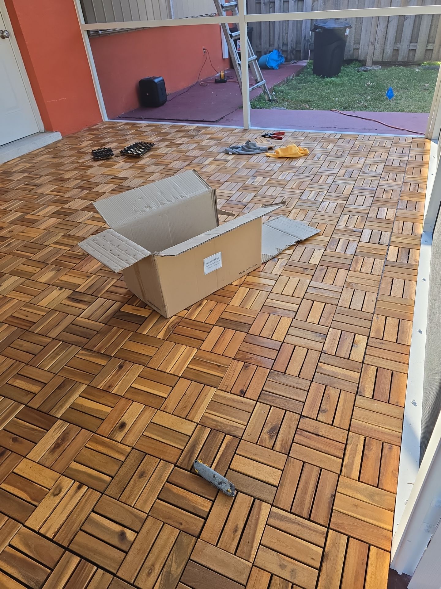 Insulated Screen Enclosure and Wood Tile Deck Installation in Plantation by Aastro Roofing