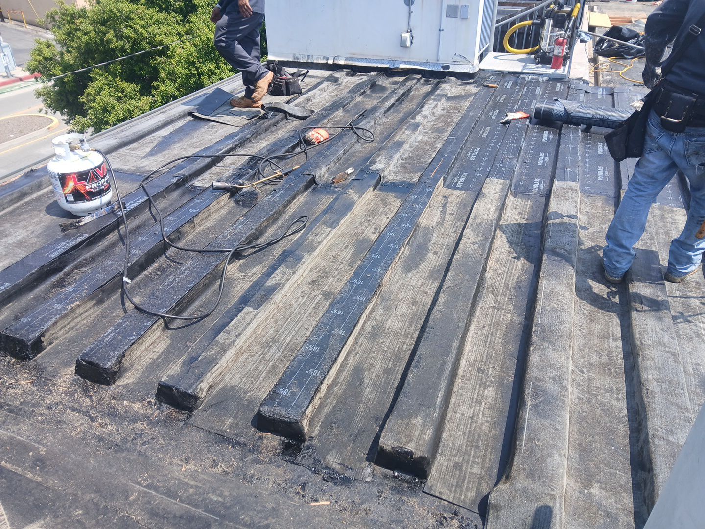 Residential Roofing Installation using Polyglass Torch Down Roofing System by Hull Brothers Roofing