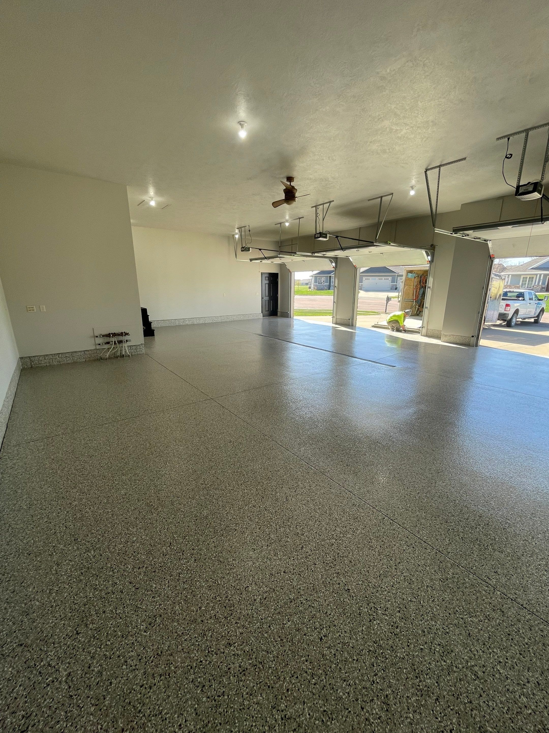 Multi-Car Garage Epoxy Floor Coating in Beresford by Select Painting, Coatings & Garage Cabinets