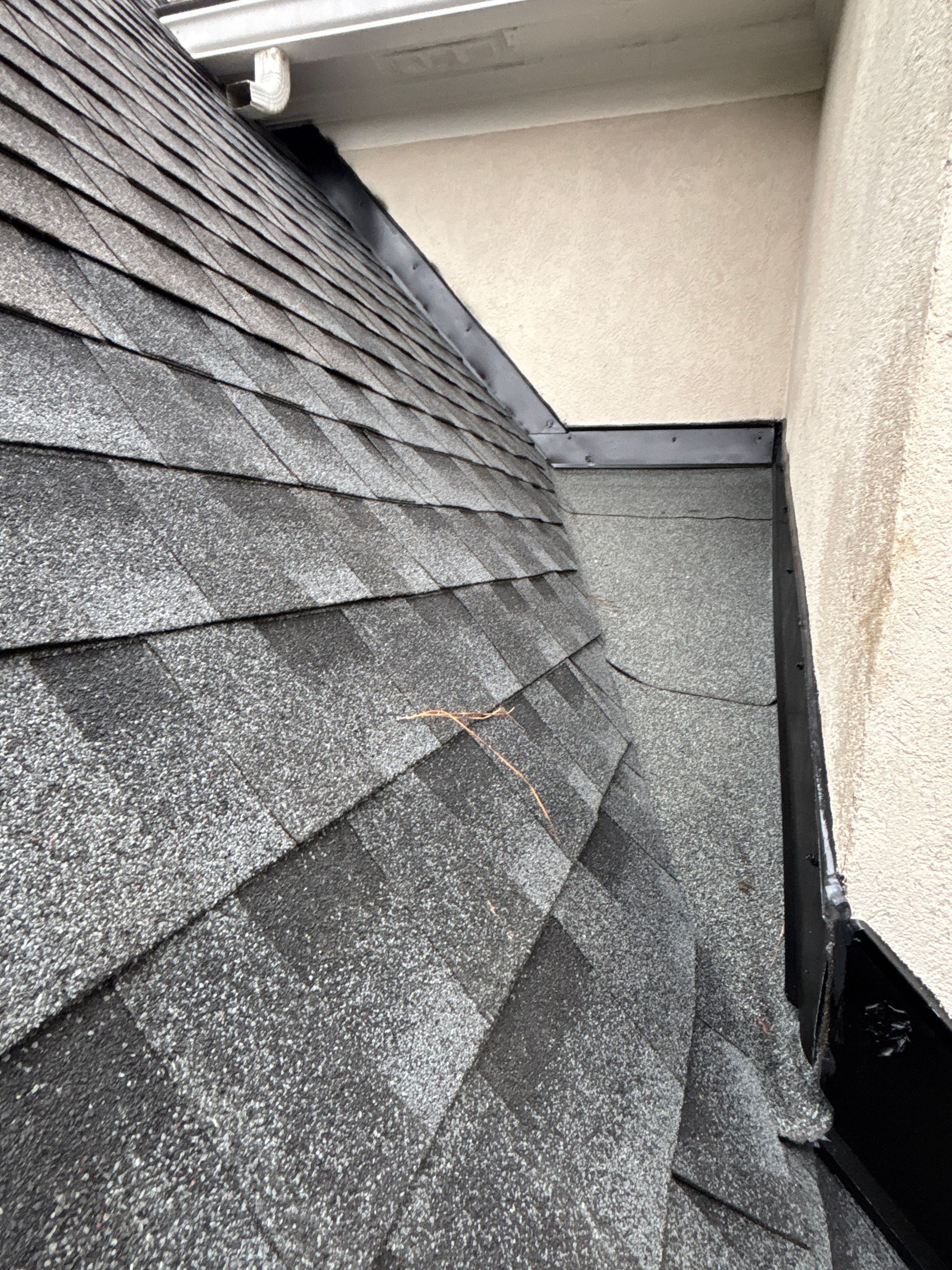 Wrong V valley section installed  by Deerfield Roofing LLC