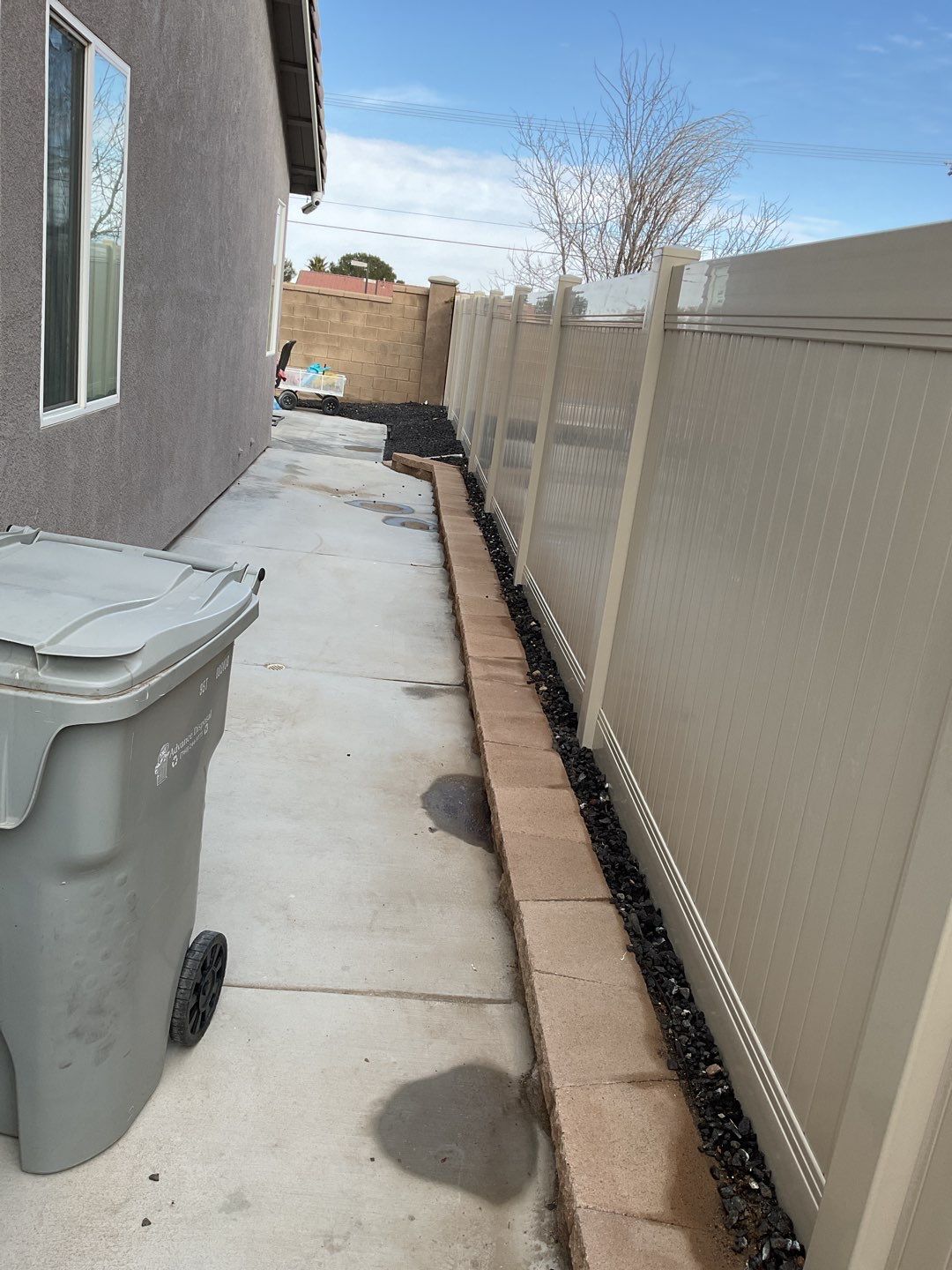Tan Privacy Vinyl Installation by Fence Guys Inc. 