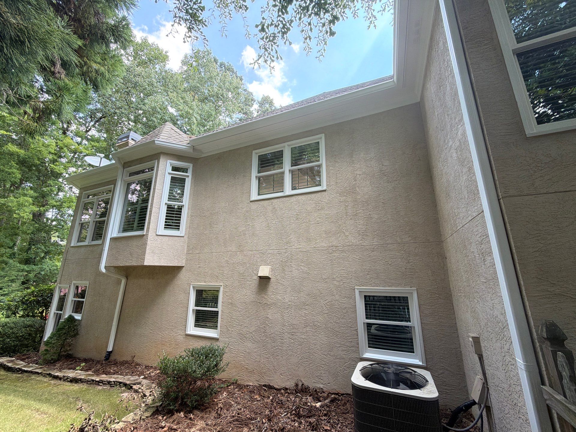 Multi-Story Stucco Home Exterior Painting and Garage Refresh in Marietta by Swift Home Renovations 