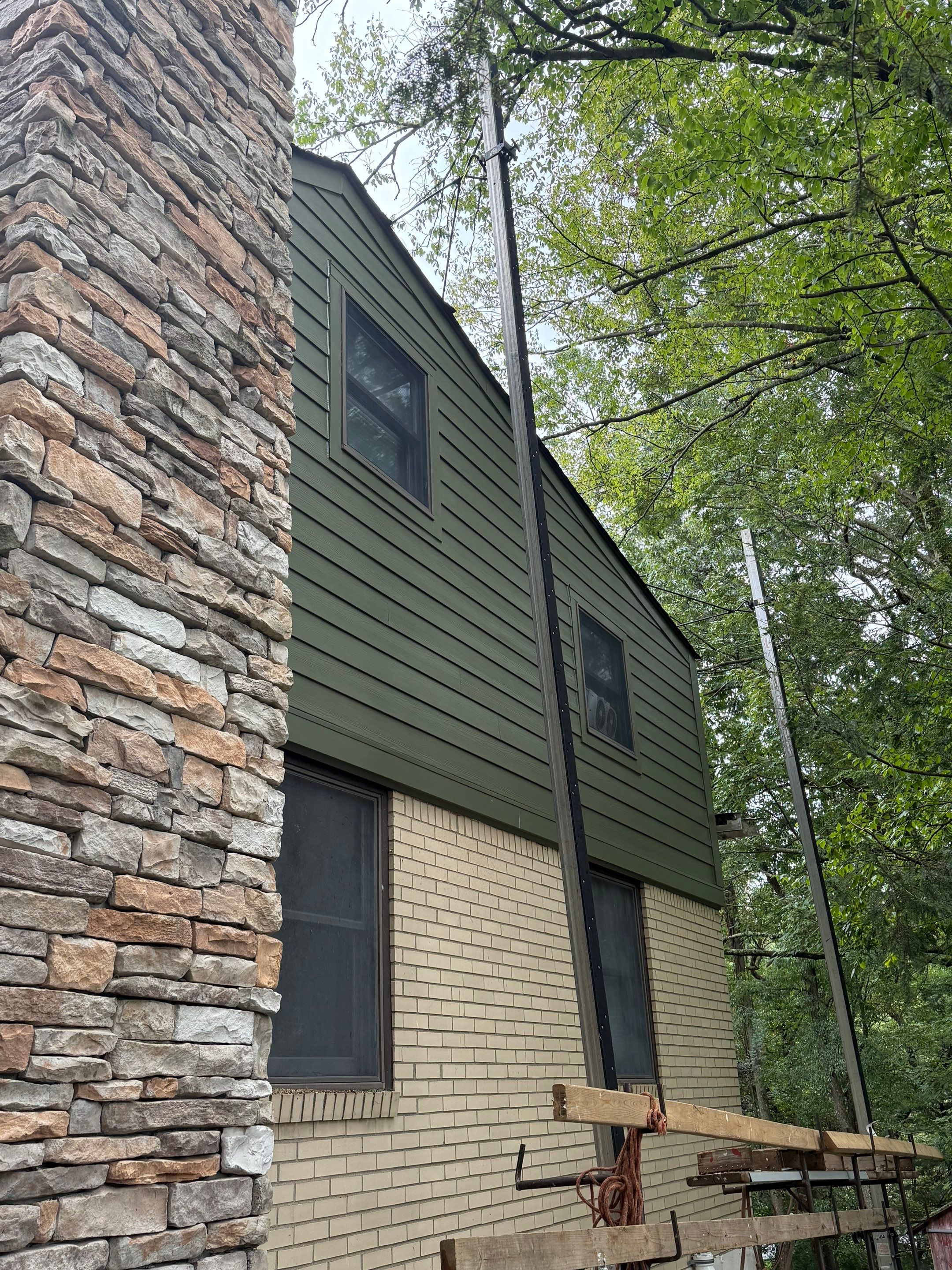 Hardie siding  by Cousins Roofing Siding & Decks
