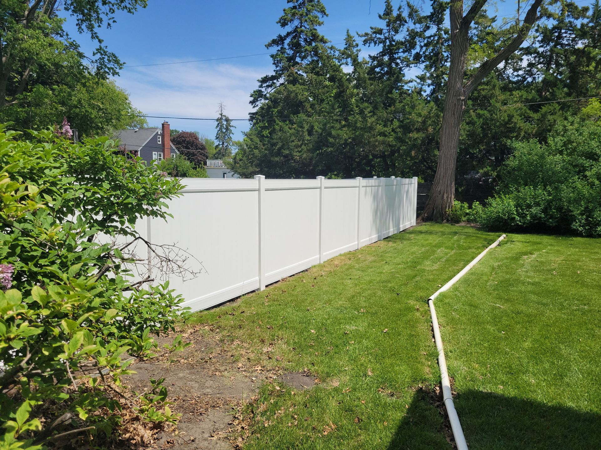 Residential White Vinyl Privacy Fence Installation in Waterloo by Perfect Picket Fence and Stain