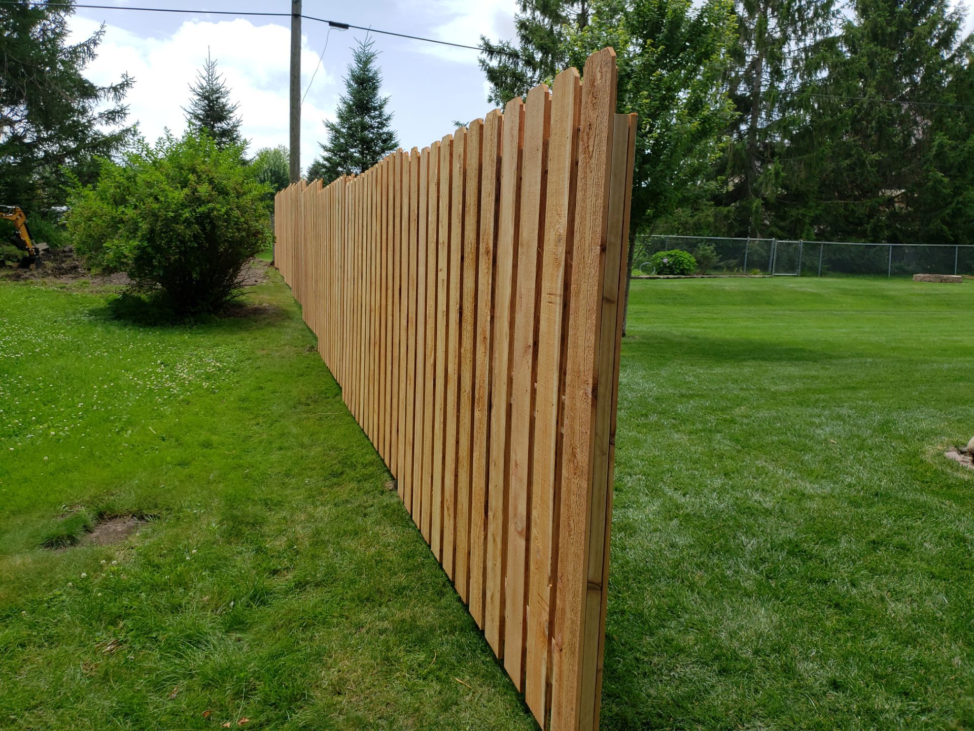 Unstained Cedar Wood Privacy Fence Installation in Cedar Falls by Perfect Picket Fence and Stain