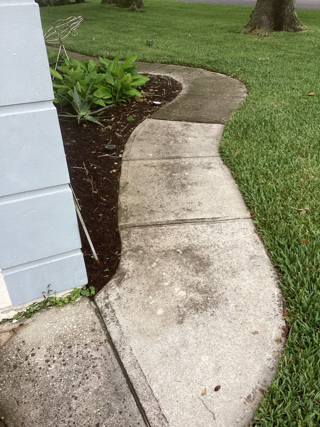 Driveway and Garage using Tidal Wave by Amvet concrete coatings llc